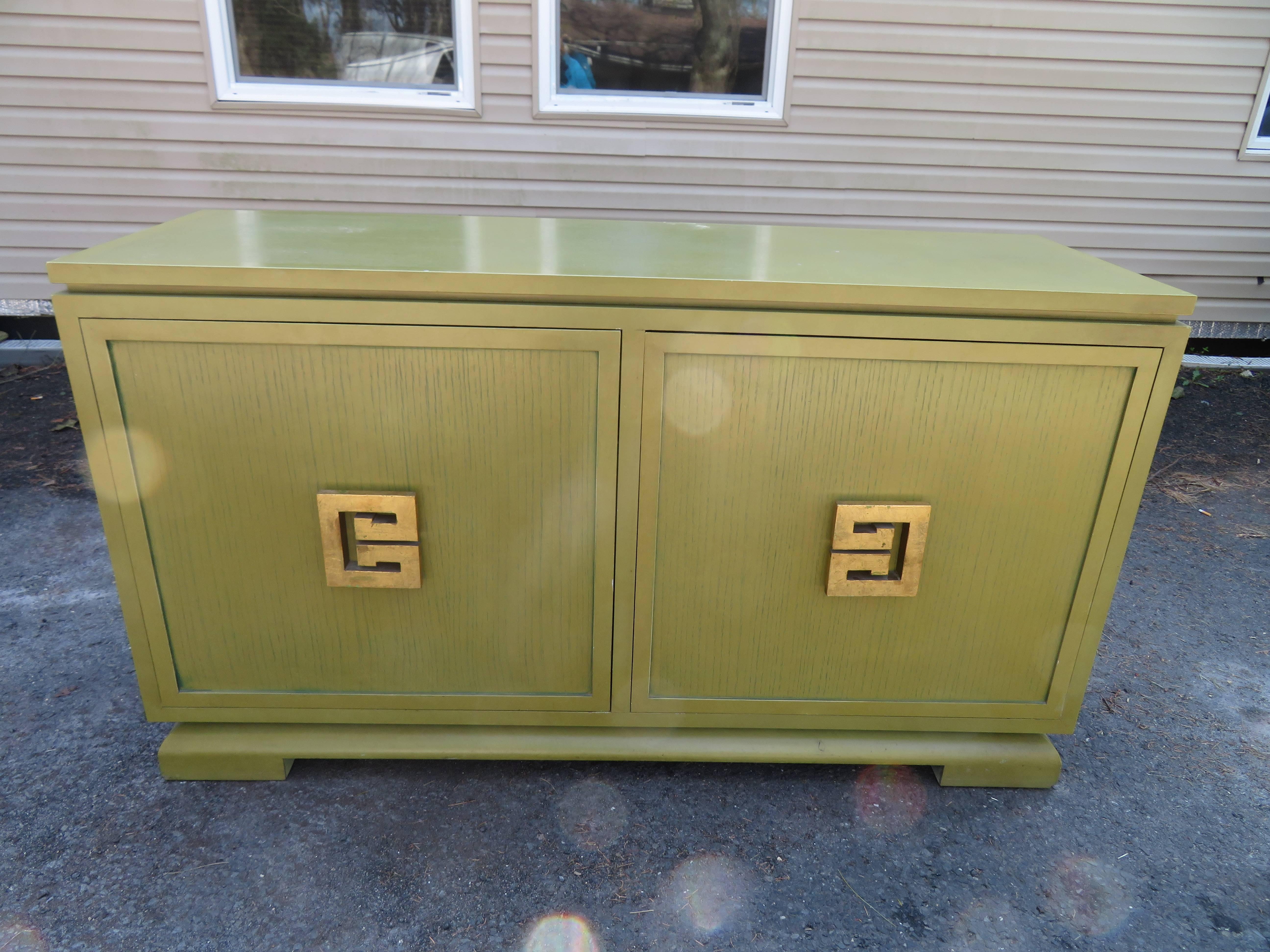 Handsome James Mont style Asian buffet credenza. We love everything about this wonderful piece from the gorgeous original lime green cerused finish to the extra tall stature- 34