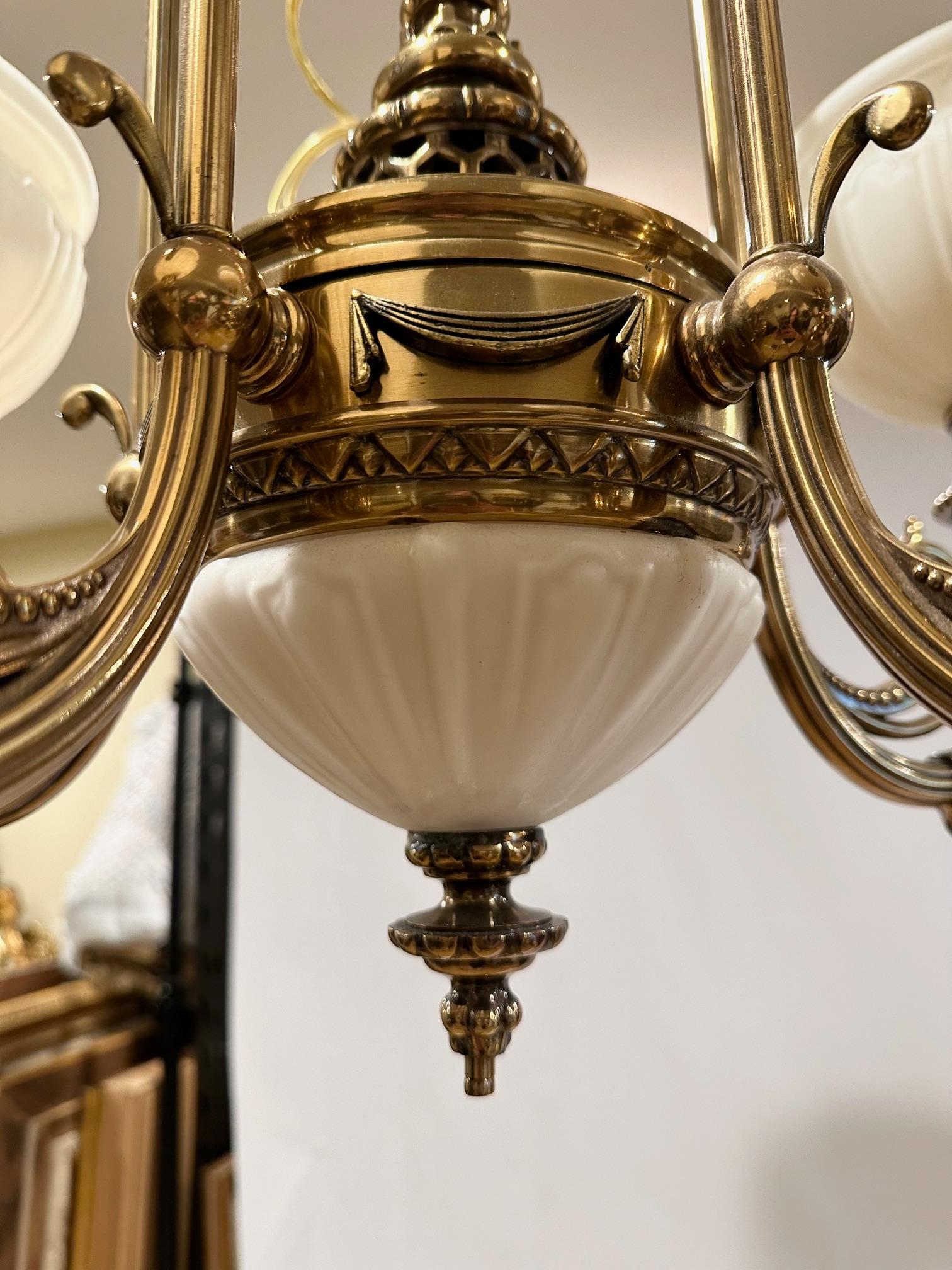 Handsome Kitchler Brass and White Opaque Glass Chandelier with 5 White Globes In Good Condition In Hopewell, NJ