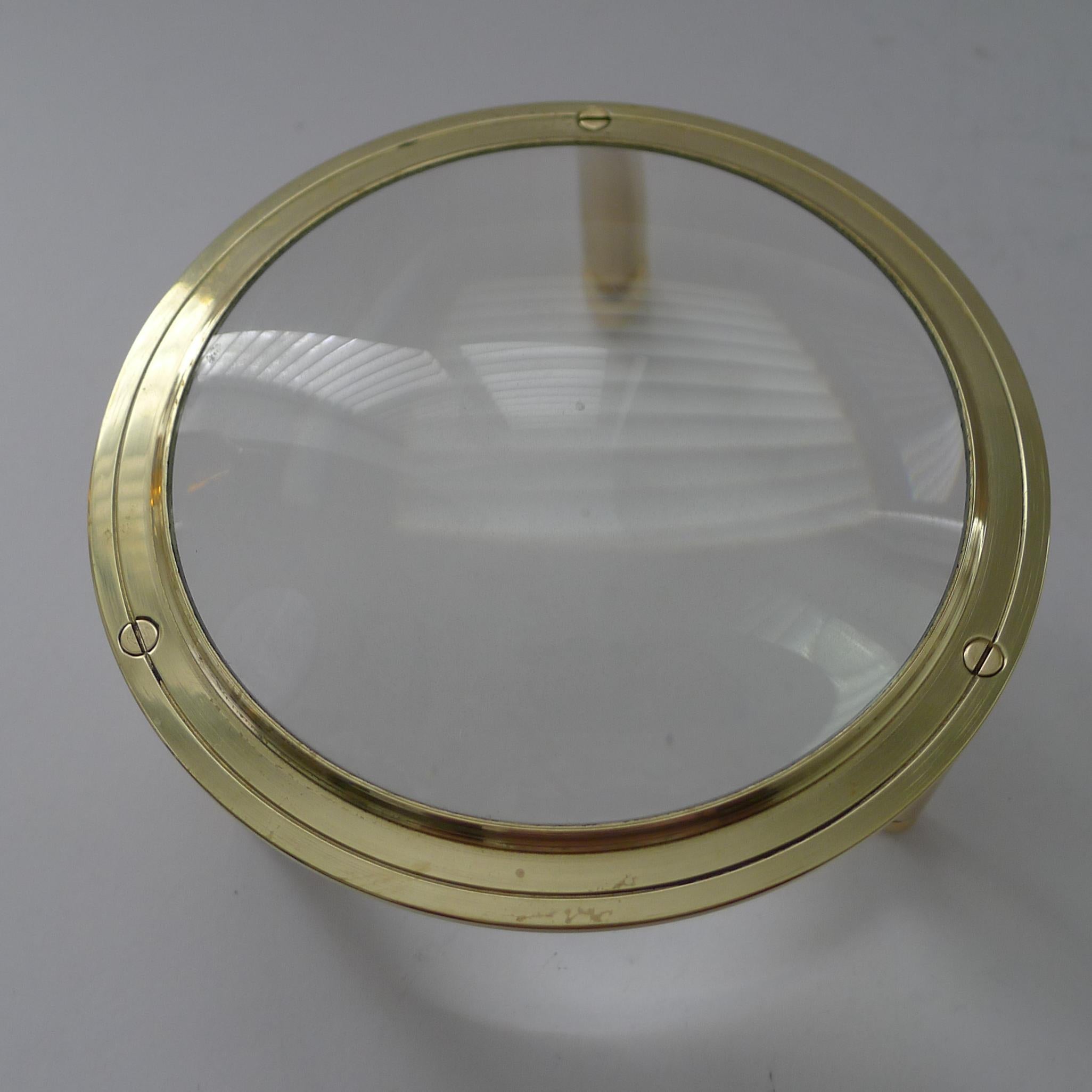 A handsome Edwardian desk / map magnifying glass, the frame made from cast English brass, professionally cleaned and polished, restoring it to it's former glory.

The domed magnifier is undamaged with a good magnification.  5