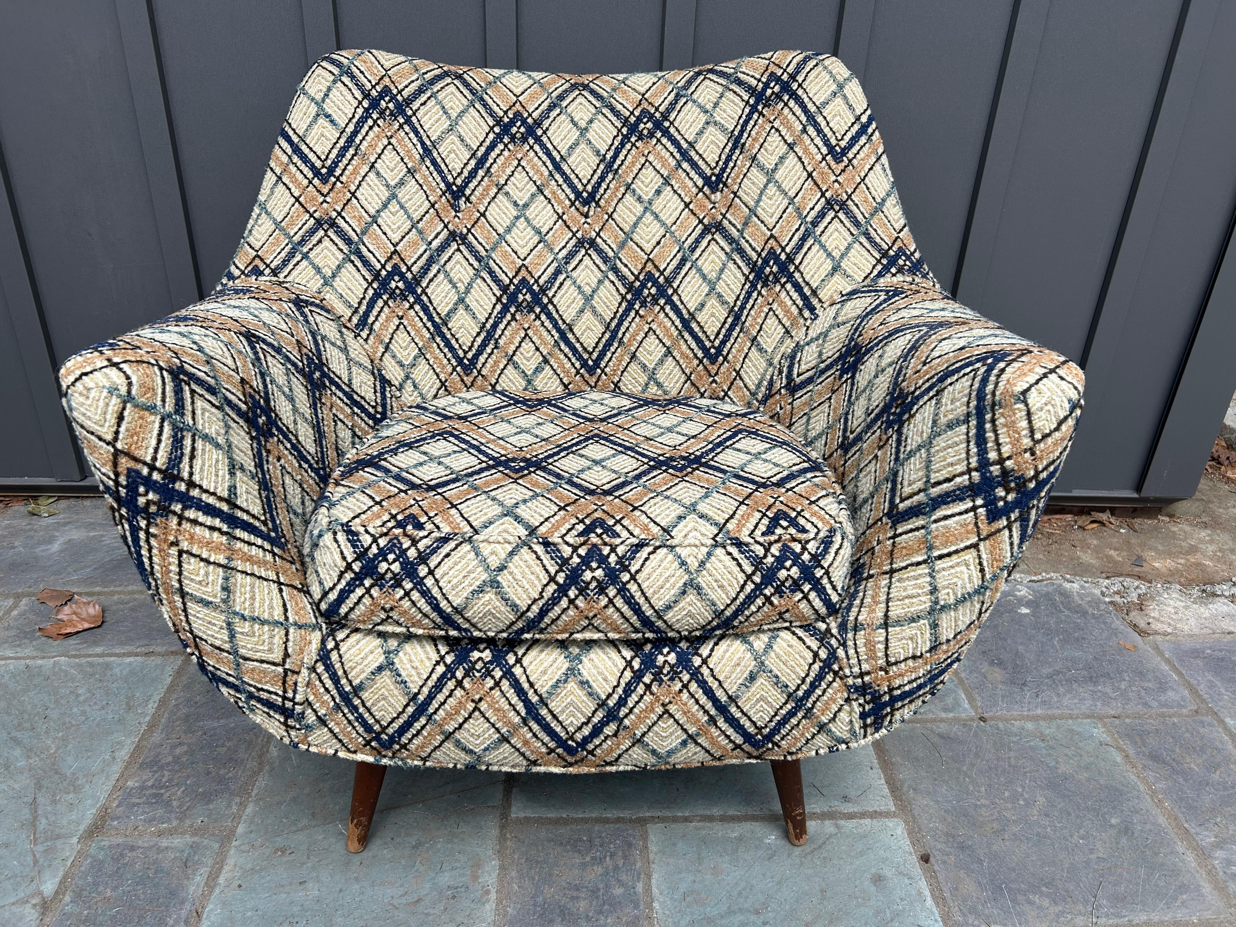 Handsome Lawrence Peabody barrel back tub chair.  We love the large-scale wide flair arms with the deep barrel back and sexy long legs. We do have several single Peabody chairs and also a matched pair done in turquoise fabric if multiples are