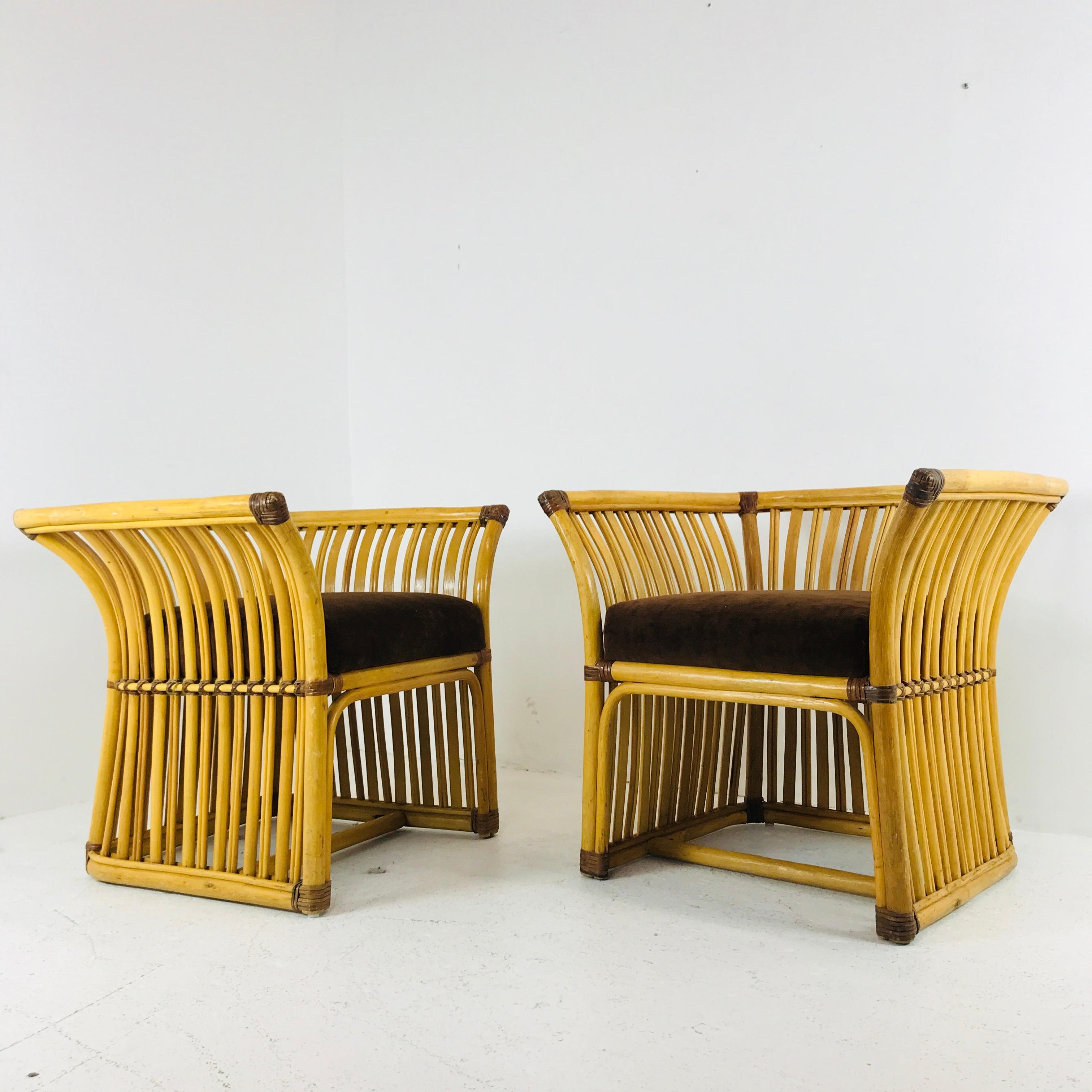 Pair of very handsome McGuire style lounge chairs. Chairs are in good condition with wear due to age and use. 

dimensions:
29.5