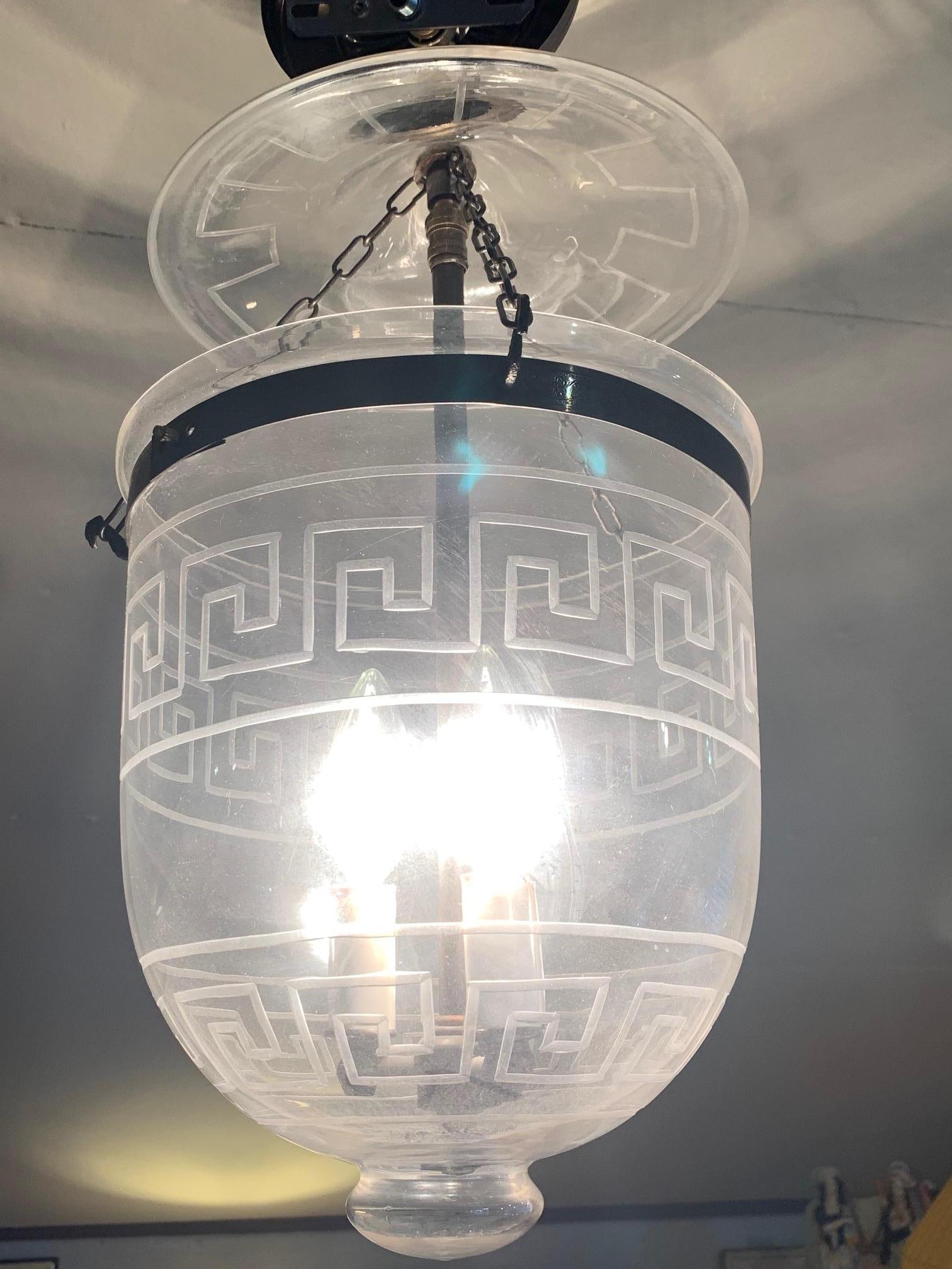 A great looking hall or foyer lantern having handsome Greek key etched design. 3-light inside and metal canopy. Chain not included.