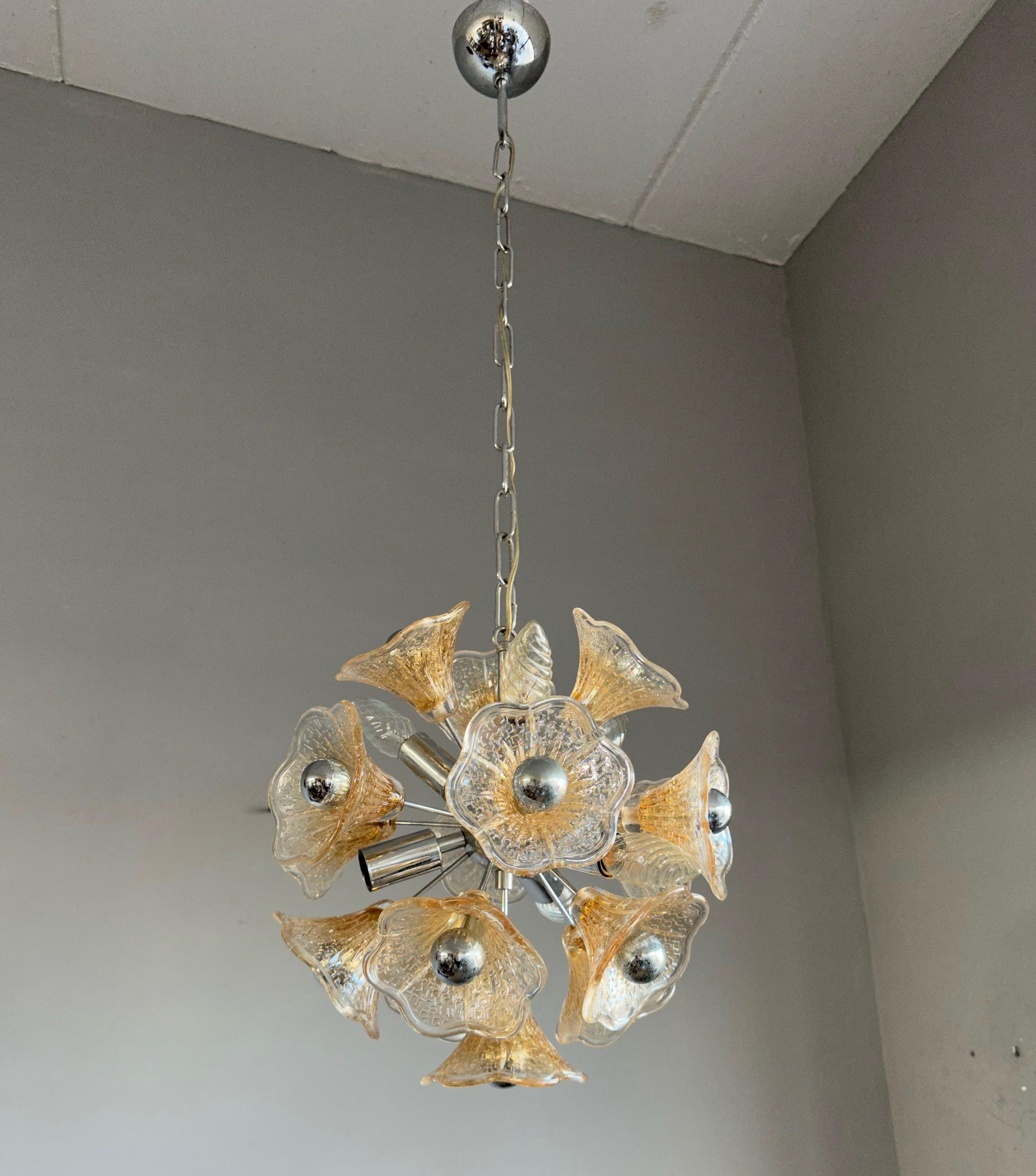 Marvelous Mid-Century Modern, stunning design, chrome & glass flowers fixture.

This aesthetically pleasing and very rare design, Murano glass pendant is in good condition and ready for you to use and enjoy. This work of lighting art can be used