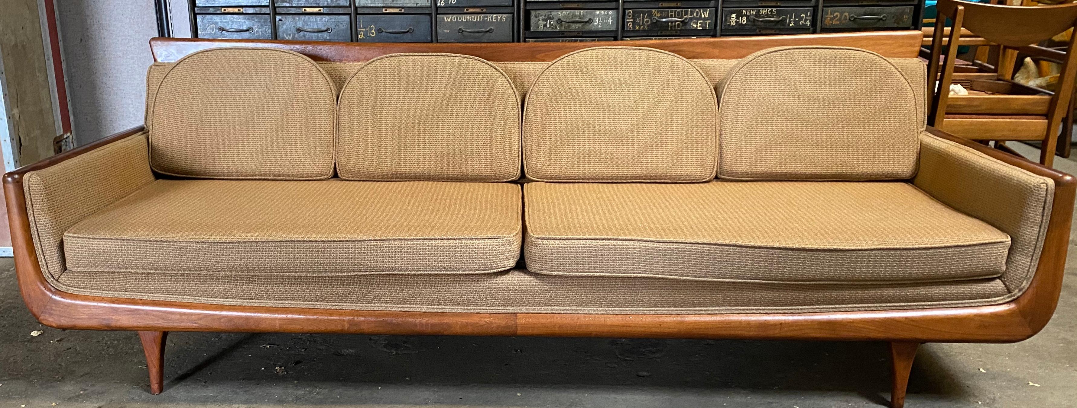 Handsome Mid-Century Modern sofa. Manner of Adrian Pearsall, unusual sculptural walnut frame. Designer. Maker unknown, retains original light brown wool fabric. In amazing condition, superior quality and construction. Classic Mid-Century Modern