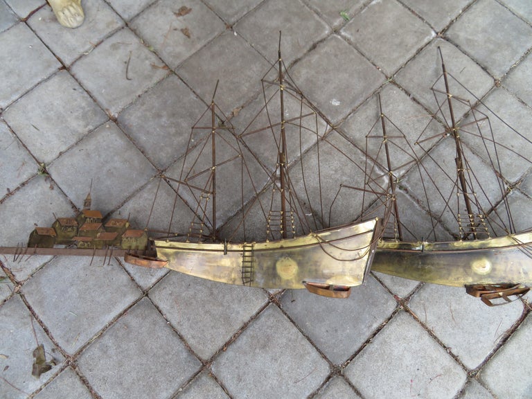 An extraordinary brutalist mid-century double sailboat wall sculpture signed and beautifully crafted out of brass. It measures 23