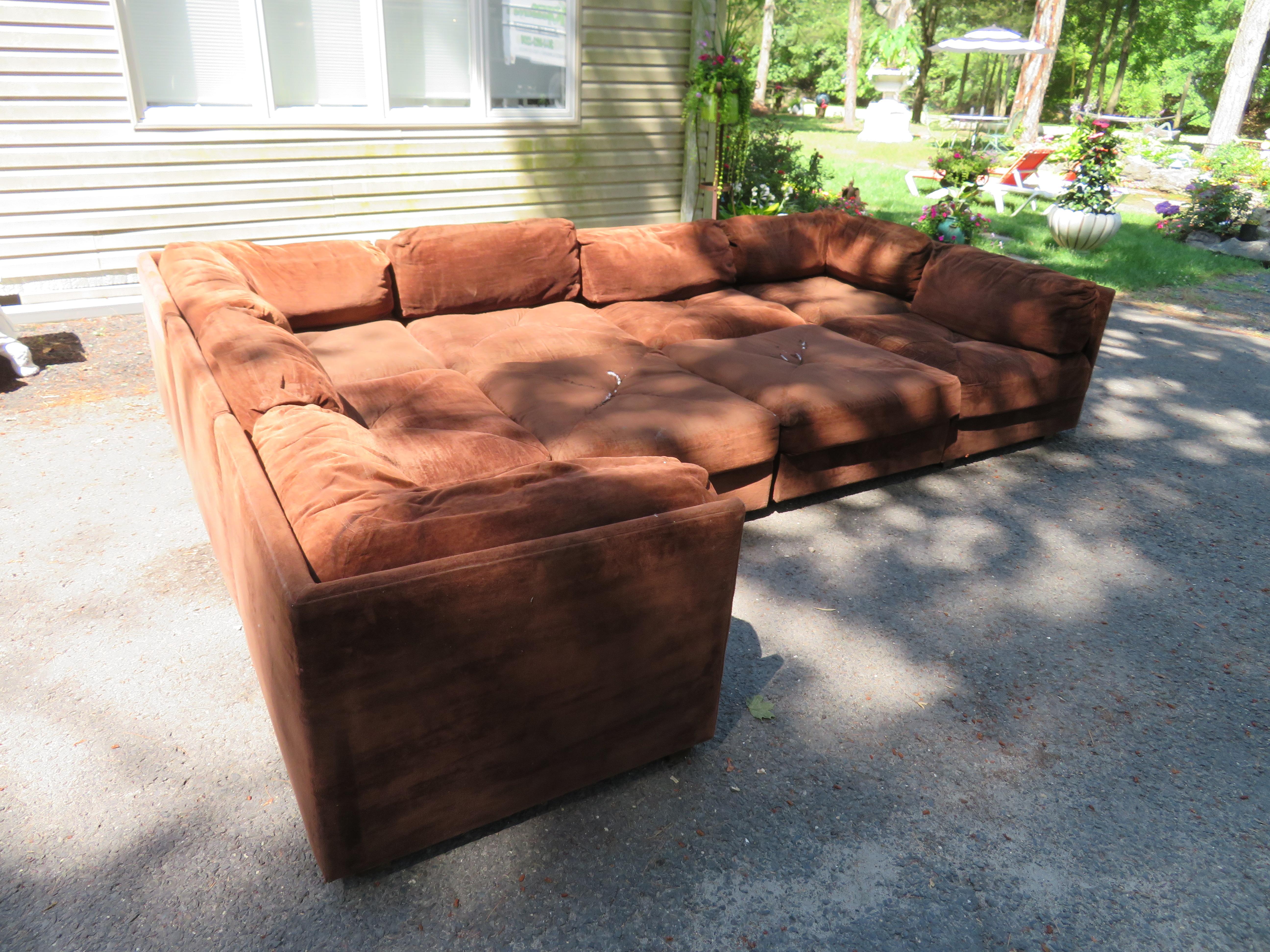 Handsome Milo Baughman style 9-piece sectional sofa by Selig. This sectional retains it's original chocolate velvet fabric which is in fair condition-reupholstery is needed. The foam is still soft and comfortable. We love these vintage modular cube