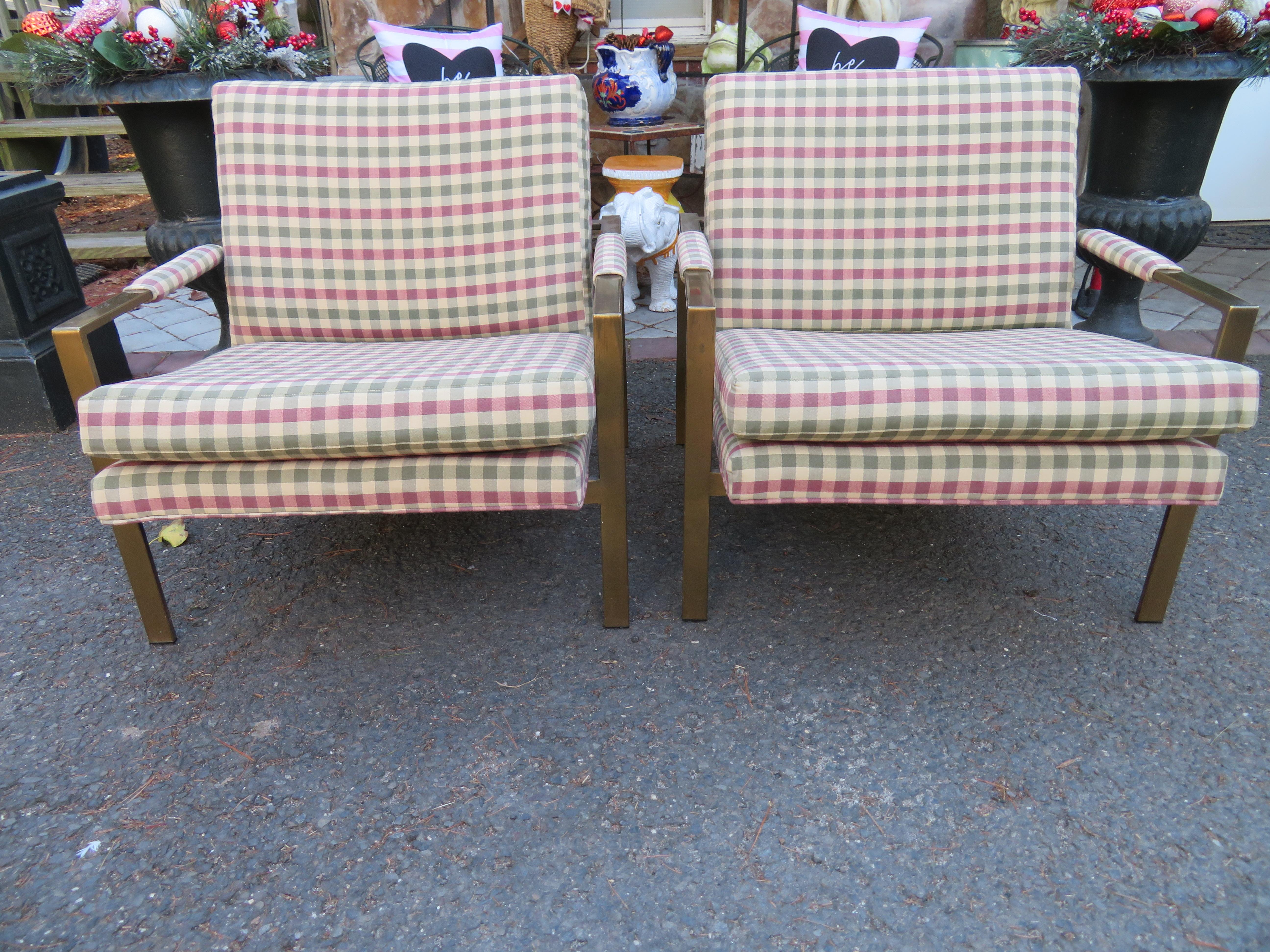 Handsome pair of Milo Baughman brass cube chairs by Thayer Coggin. We love the Burberry style upholstery which appears to be recently done along with the antiqued brass frames. These charming lounge chairs have a tremendous vintage appeal. They