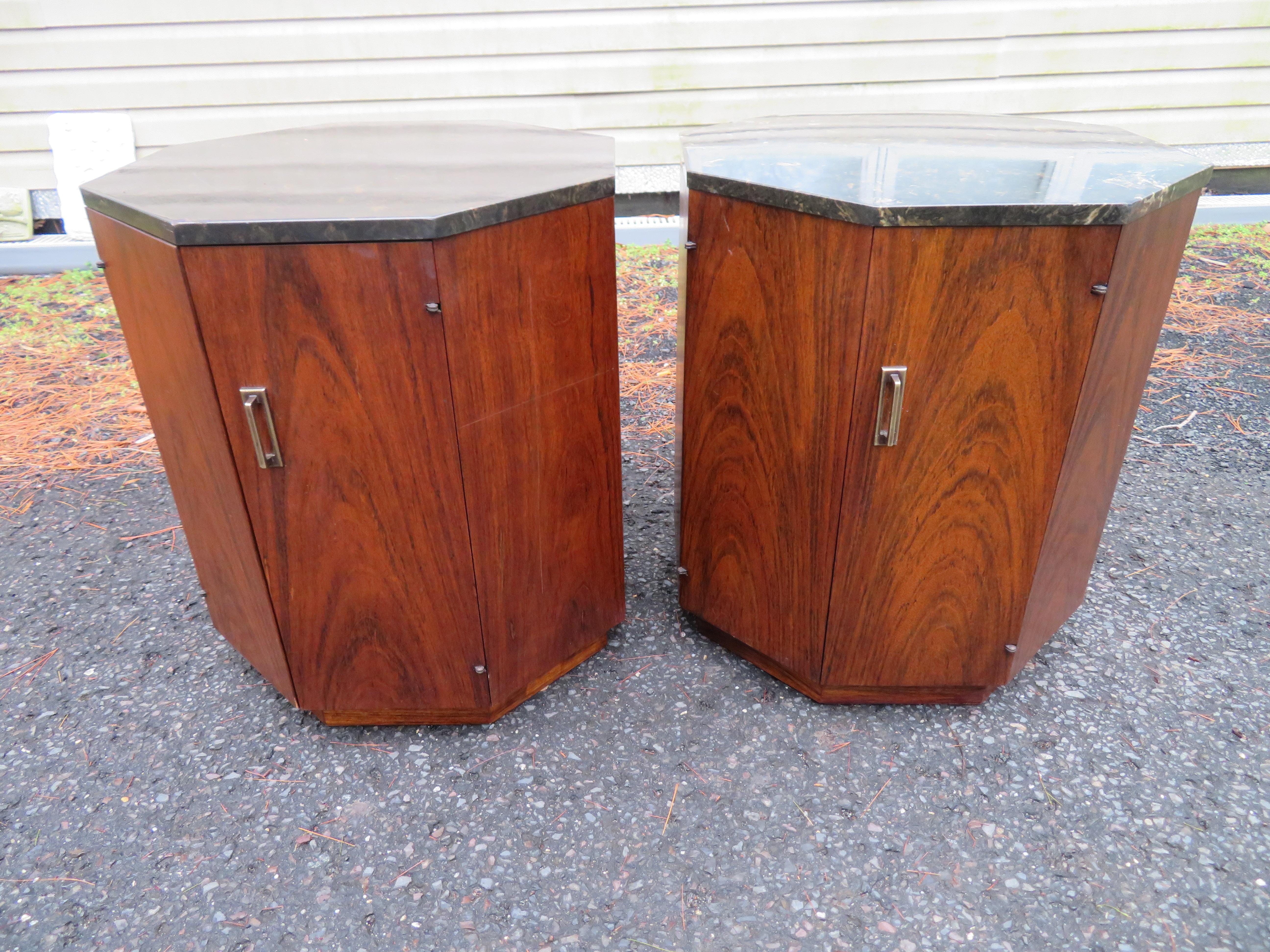 Handsome pair of Harvey Probber style octagon-shaped drum tables with hidden storage inside.    These are very similar to the much-coveted octagon dry bars that Harvey Probber designed in the 60's.  We believe these were made by the Lane Furniture