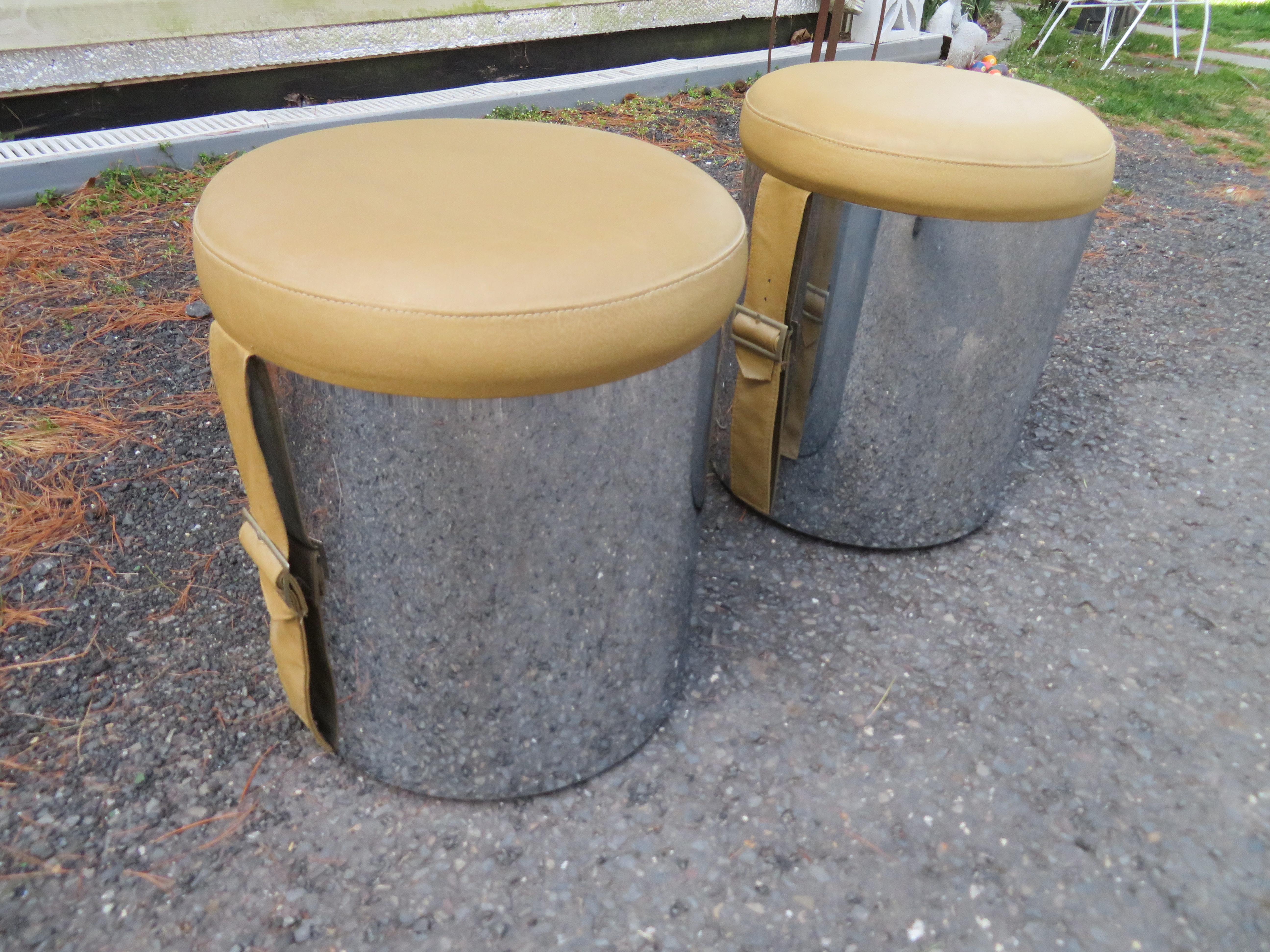 Stylish pair of Mio Baughman style chrome cylinder and faux leather stools/ ottomans. We love the fun buckled straps adding to their vintage charm. They measure 17