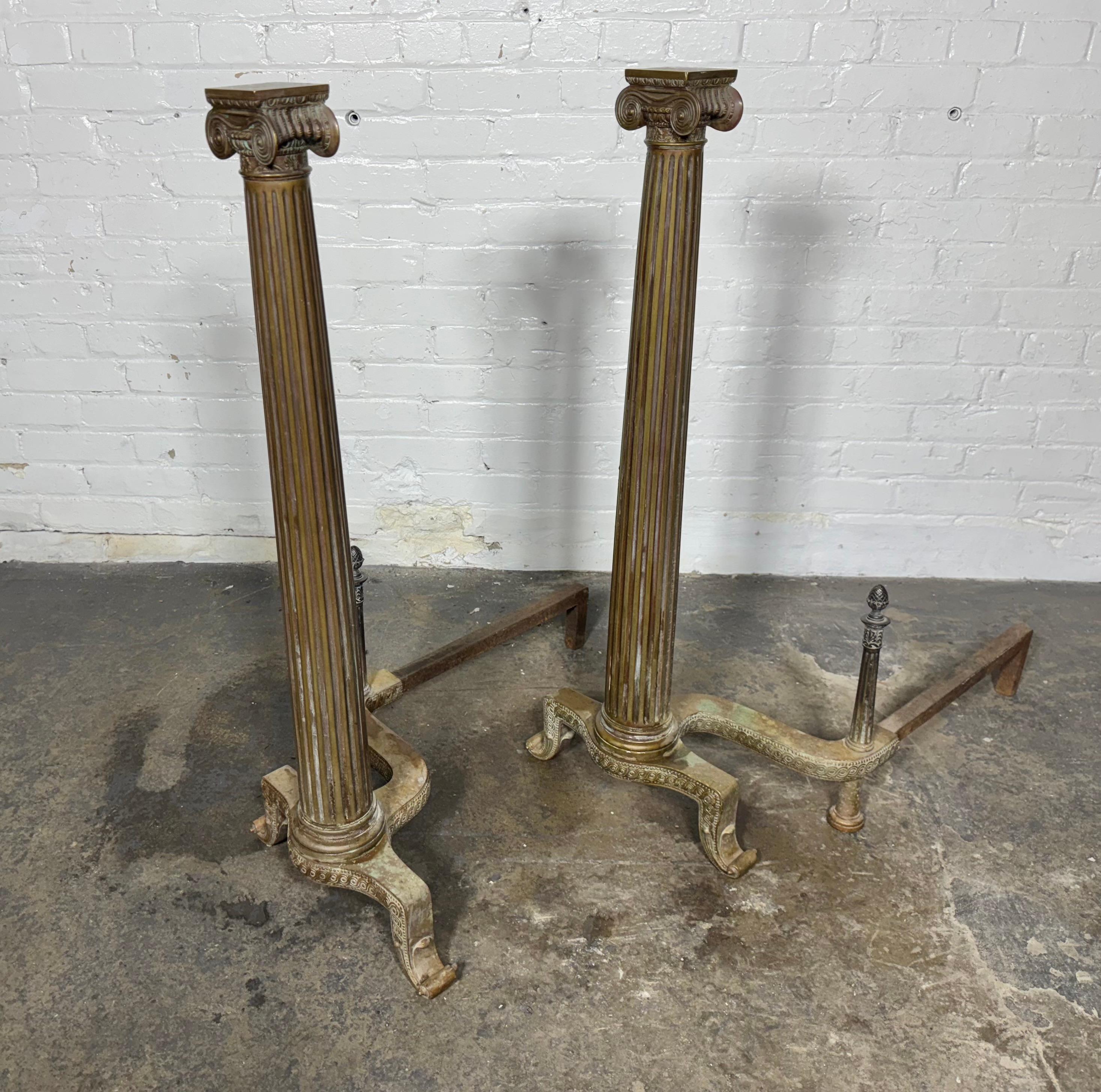 Handsome Pair of 19th Century French Neoclassical Column Bronze Andirons. finished in luxurious Louis XVI taste, the European antiques feature rich detailing throughout, finely chiseled and chased, fluted column with wonderfully textured. Great