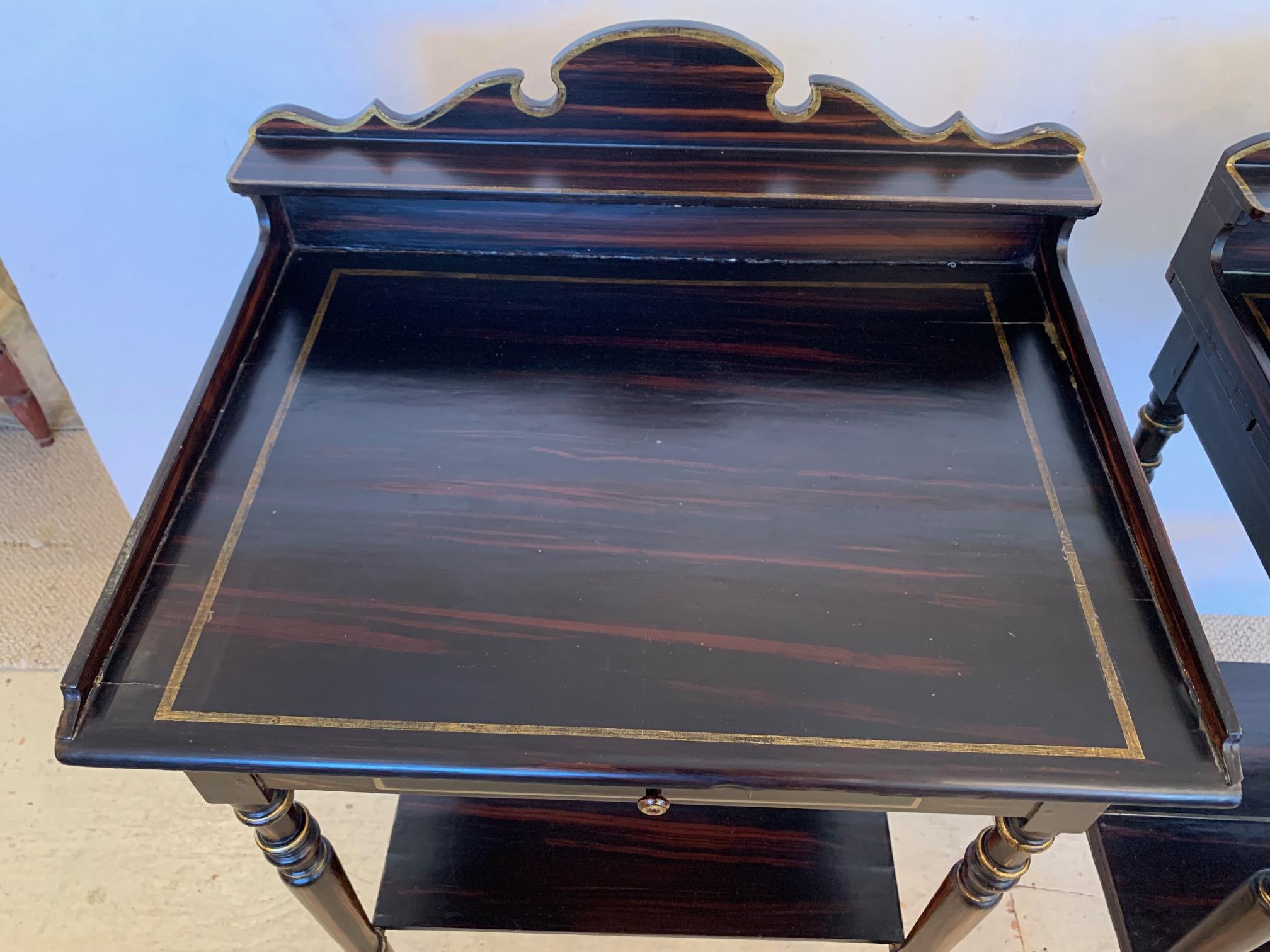 Lovely two tier beautiful grain painted night stand or end table having gilded embellishments including accent stripe around the top surface that looks like inlay.  Single drawer, lower tier, and decorative scalloped backsplash. Legs are carved and