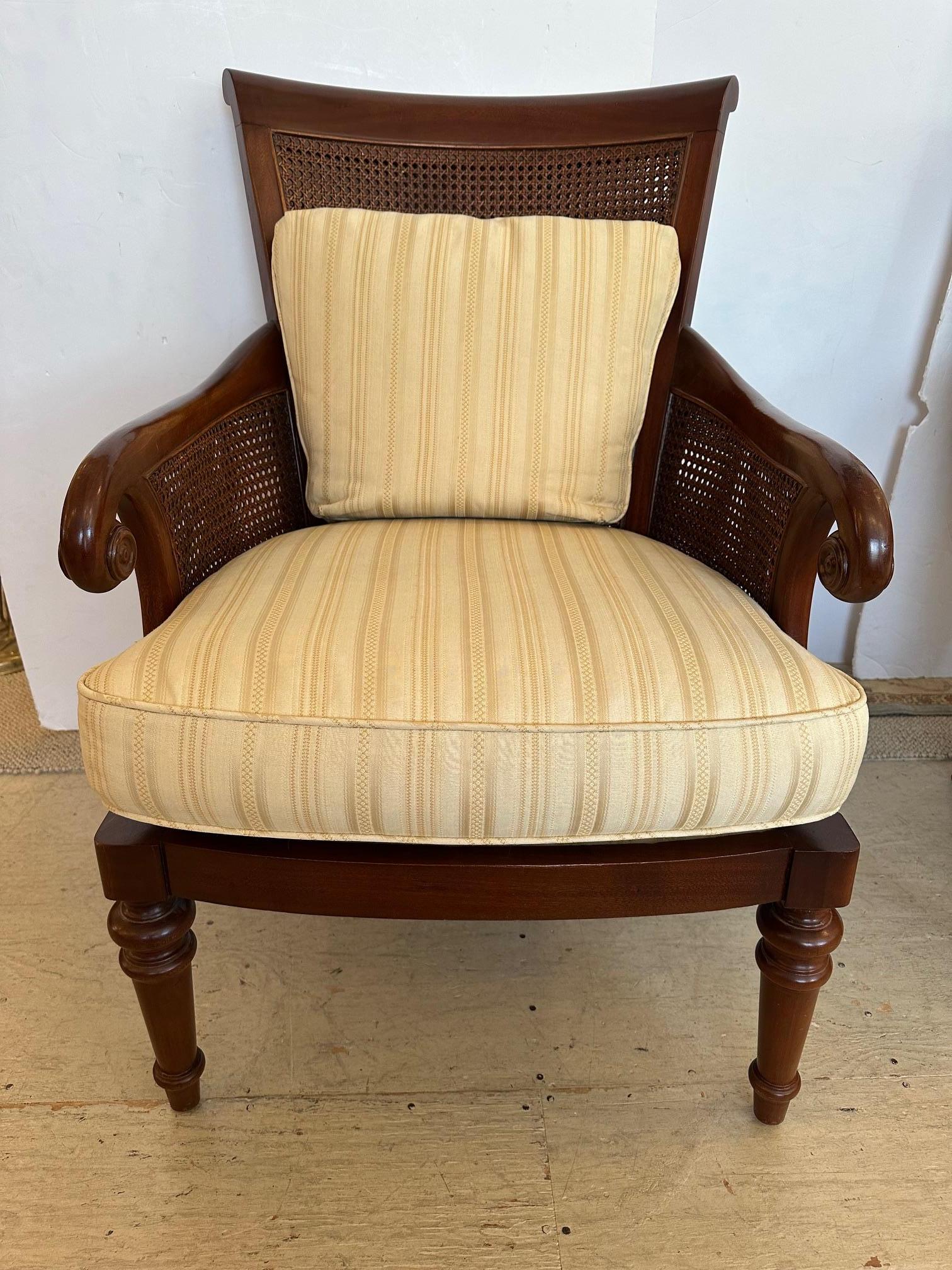 Pair of Mark Hampton mahogany Regency style armchairs having double caned backs, curved arms, turned legs and custom upholstered cushions.
Arm 27” H
Seat 24” D x 20” H