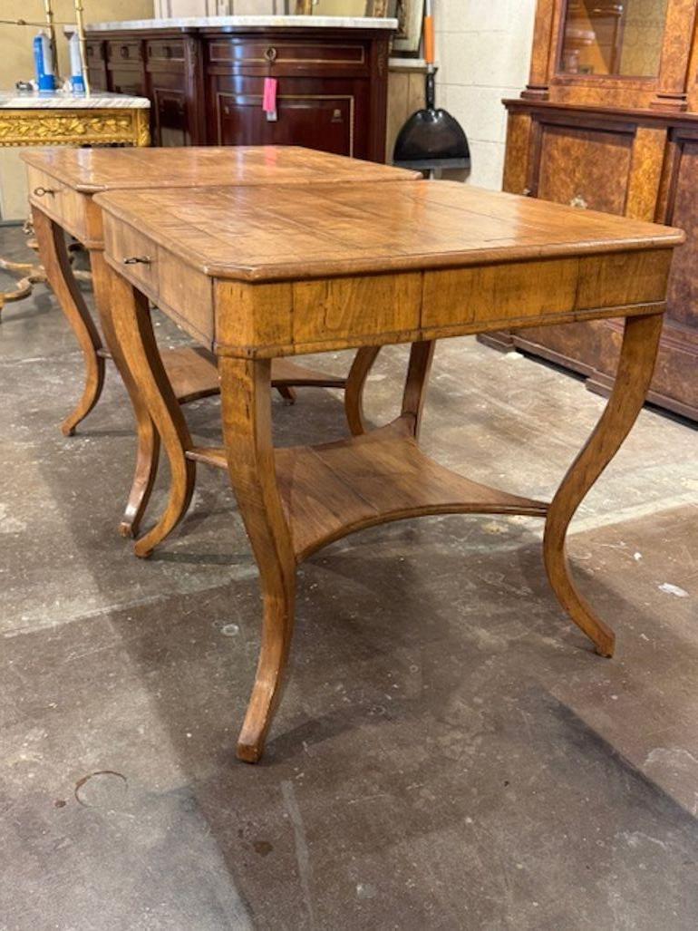 This product is a pair of custom made Italian walnut side tables The quality design of these side tables would make a stylish addition to any home décor. Perfect for serving drinks or displaying decorative items, these tables are both functional and