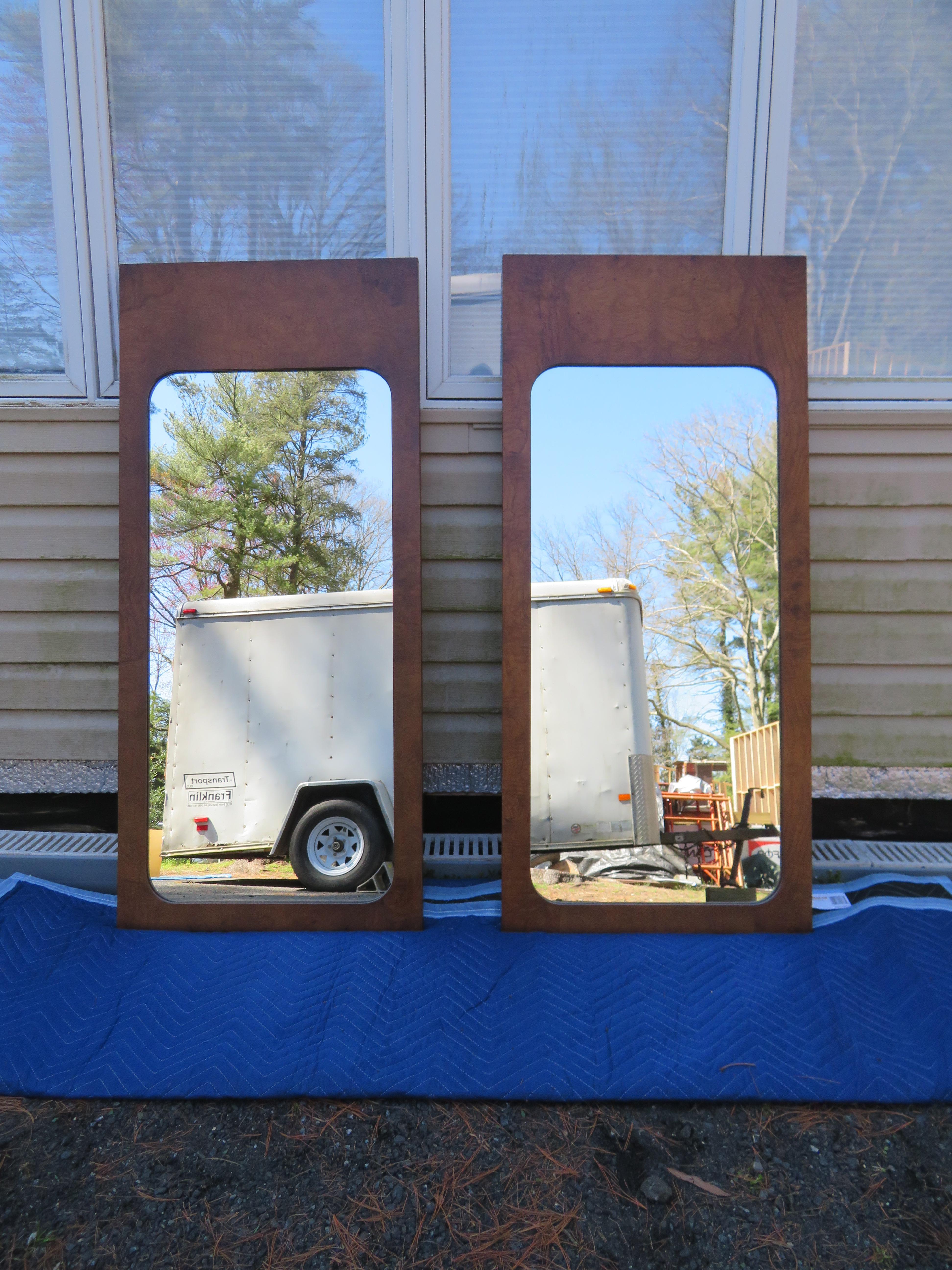 Handsome pair of vintage modern Roland Carter for Lane burl olivewood mirrors. Sleek rectangular design with elegant wood grain throughout makes these wonderful mirrors the perfect addition to any modern interior. They measure 47