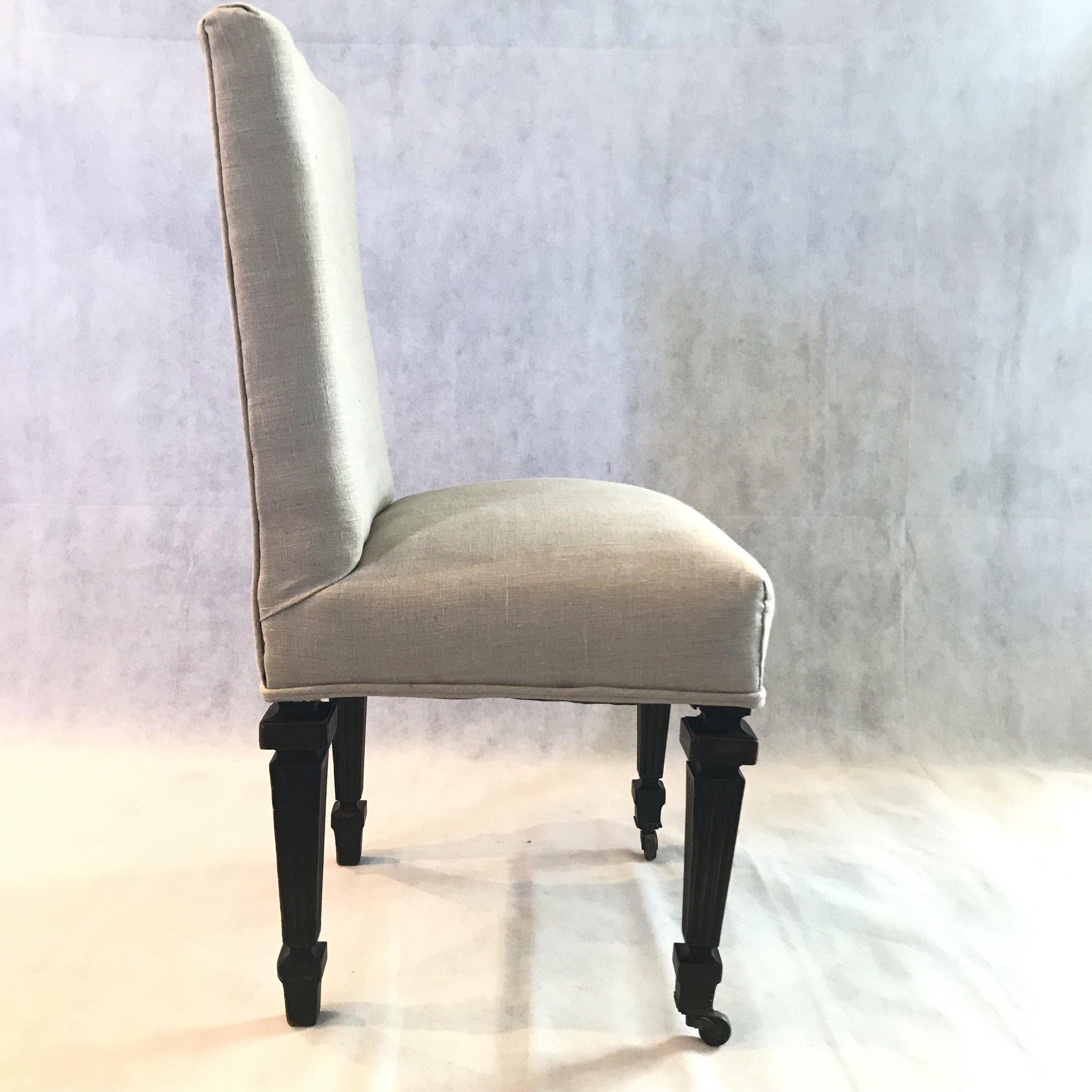 Elegant pair of Napoleon III black french antique chairs having original paint and frame. Front legs have original casters. Bought in Avignon, France. New neutral handsome upholstery.

#1519.