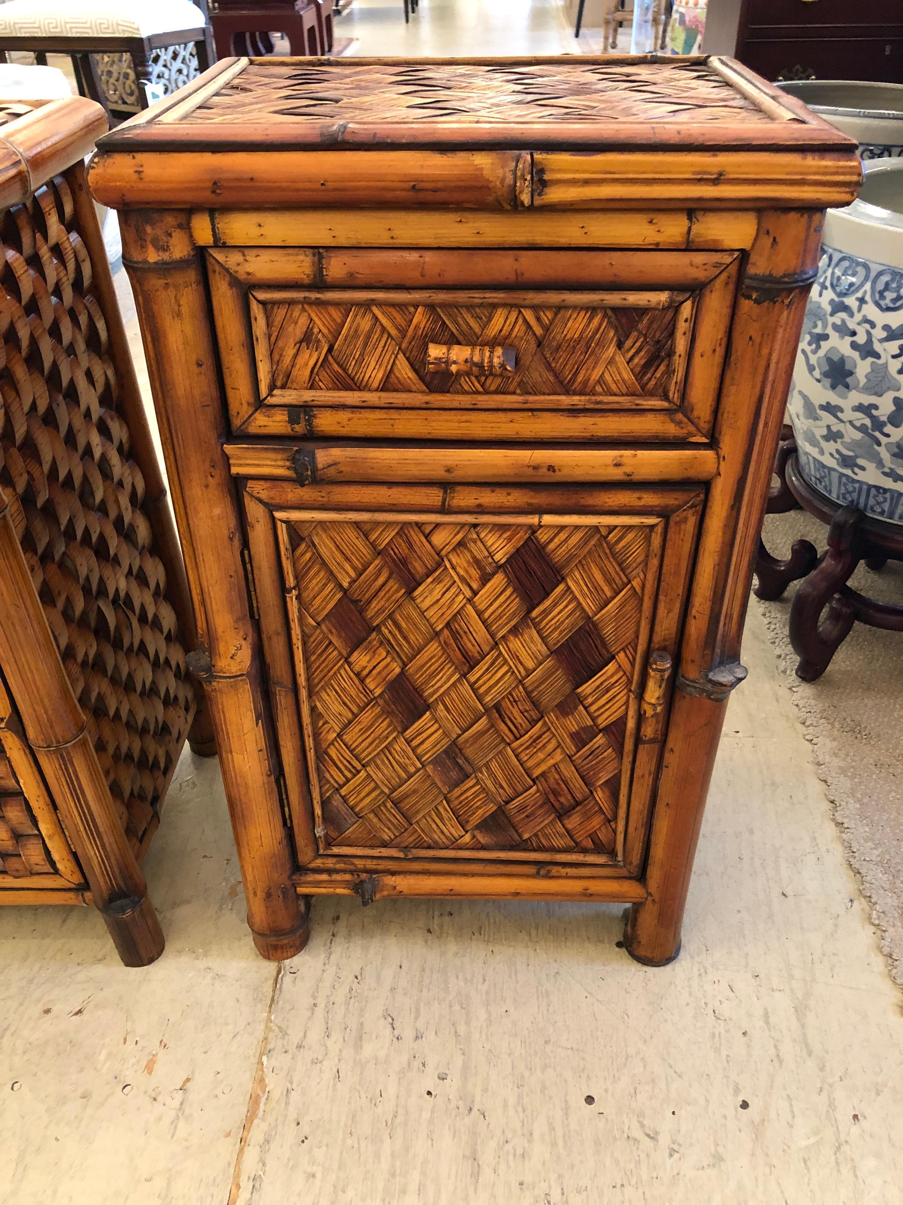 Handsome slightly different pair of rattan wicker cabinet night stands each with single drawer and door revealing storage within.  One cabinet is slightly smaller measuring 15.25 w 11 d 26.5 h