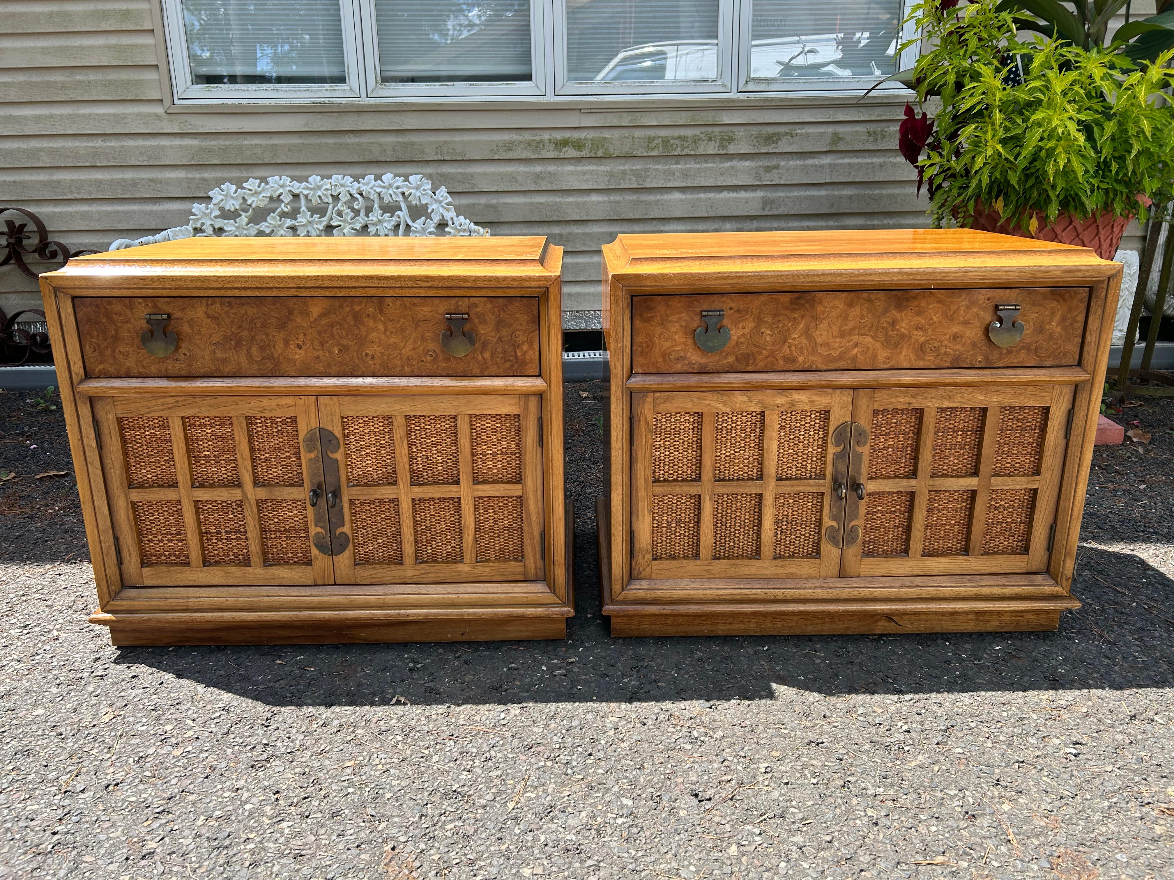 Handsome pair vintage Thomasville burl wood and caned front night stands.  We love the classic modern design with the paneled caned front doors and warm burl wood drawer fronts.  The patinated brass hardware is also quite nice-see photos.  These
