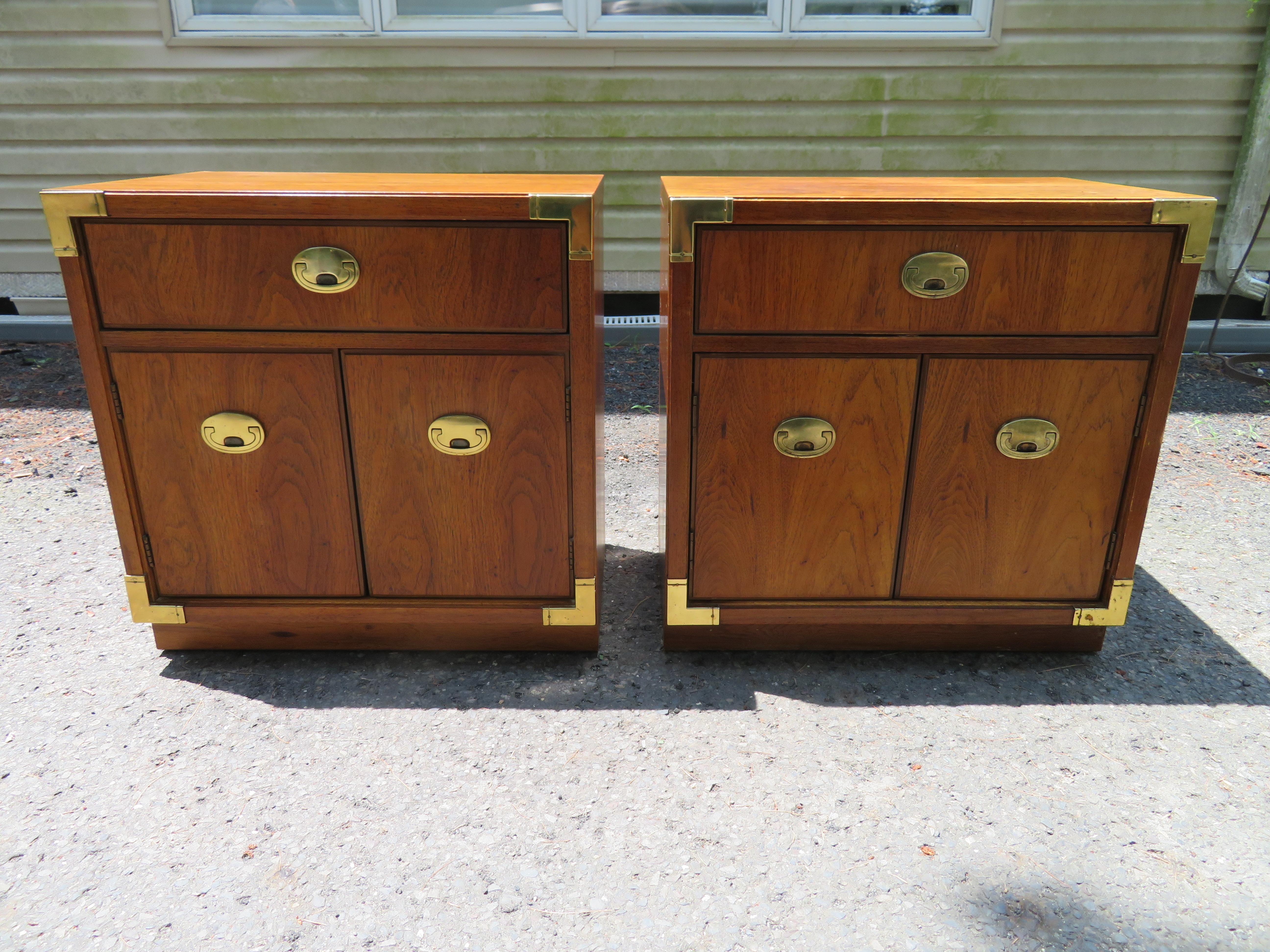 Handsome pair of Thomasville Passport campaign style night stands with their matching queen size headboard. Solid, heavy, high quality wood and very well crafted. Dovetail drawers glide well. Clean lines. Beautiful solid brass hardware. Night stands