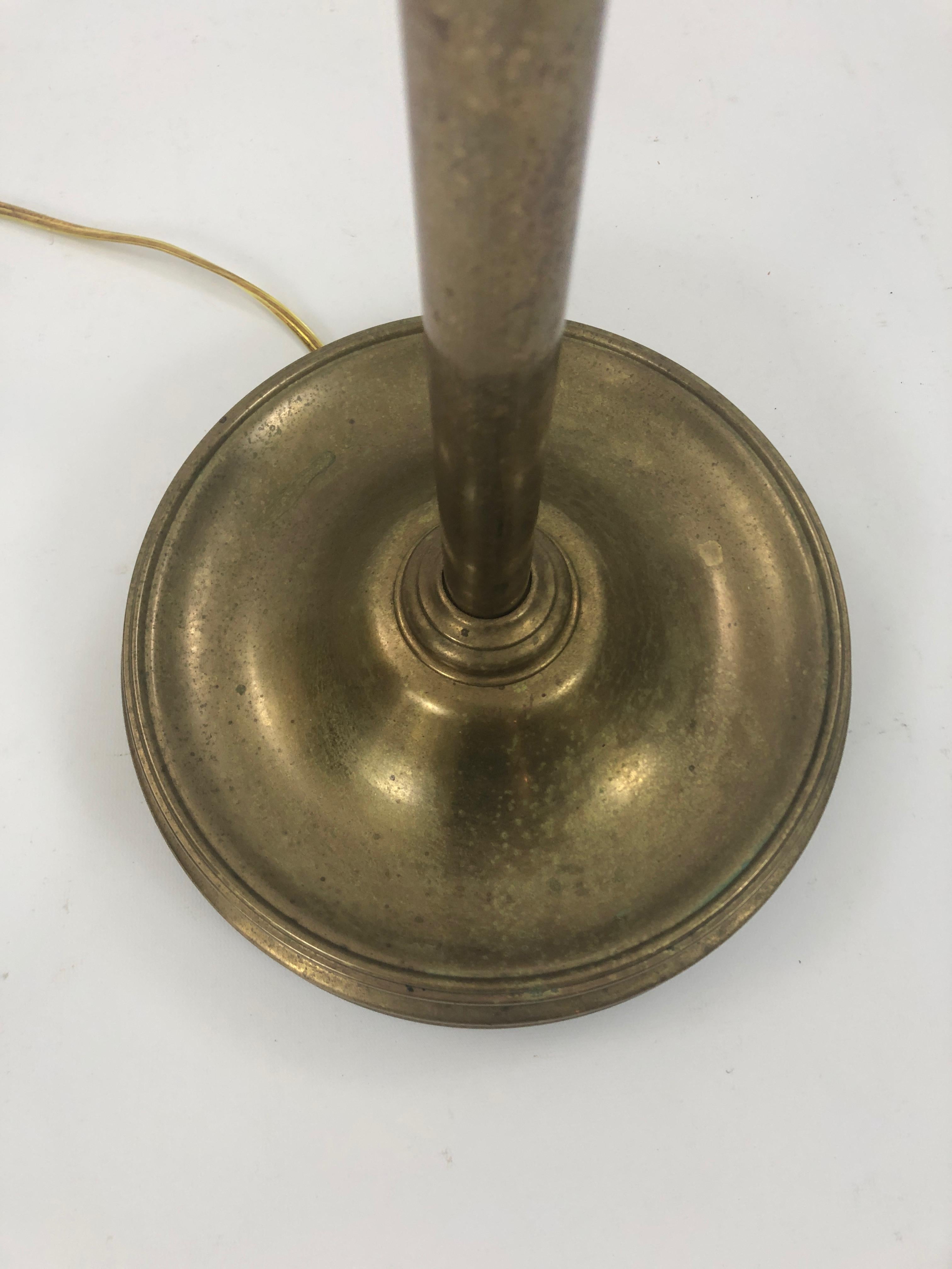 A Classic adjustable brass floor lamp by Ralph Lauren with the name of the maker on the base. 60 watt.
  