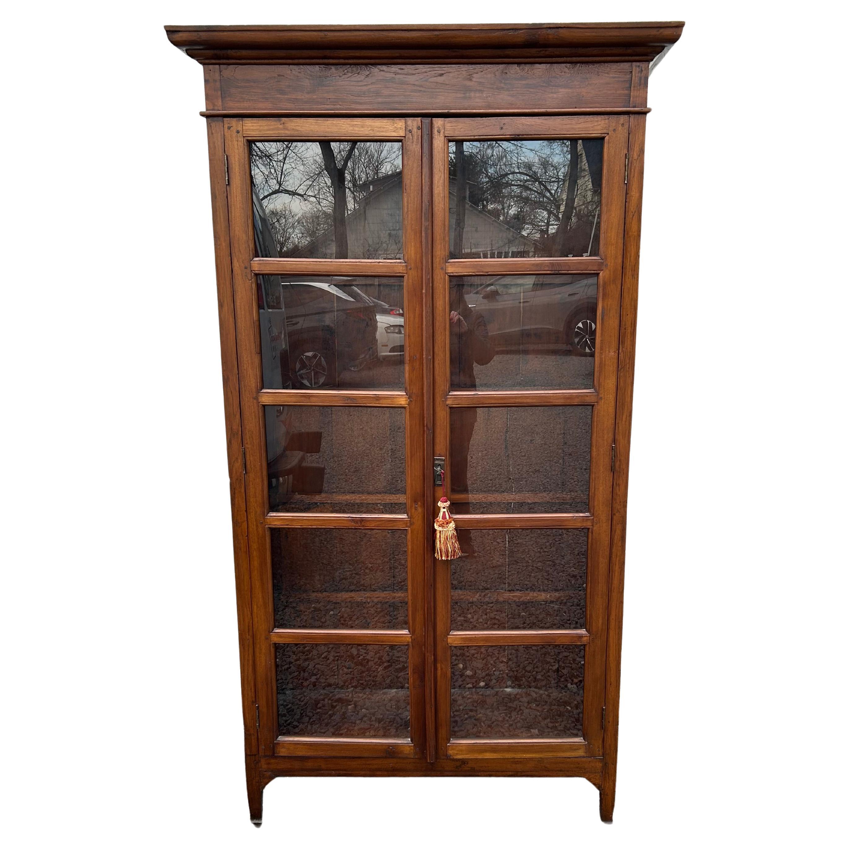 Handsome Reclaimed Teak Cabinet with Glass Panel Doors For Sale