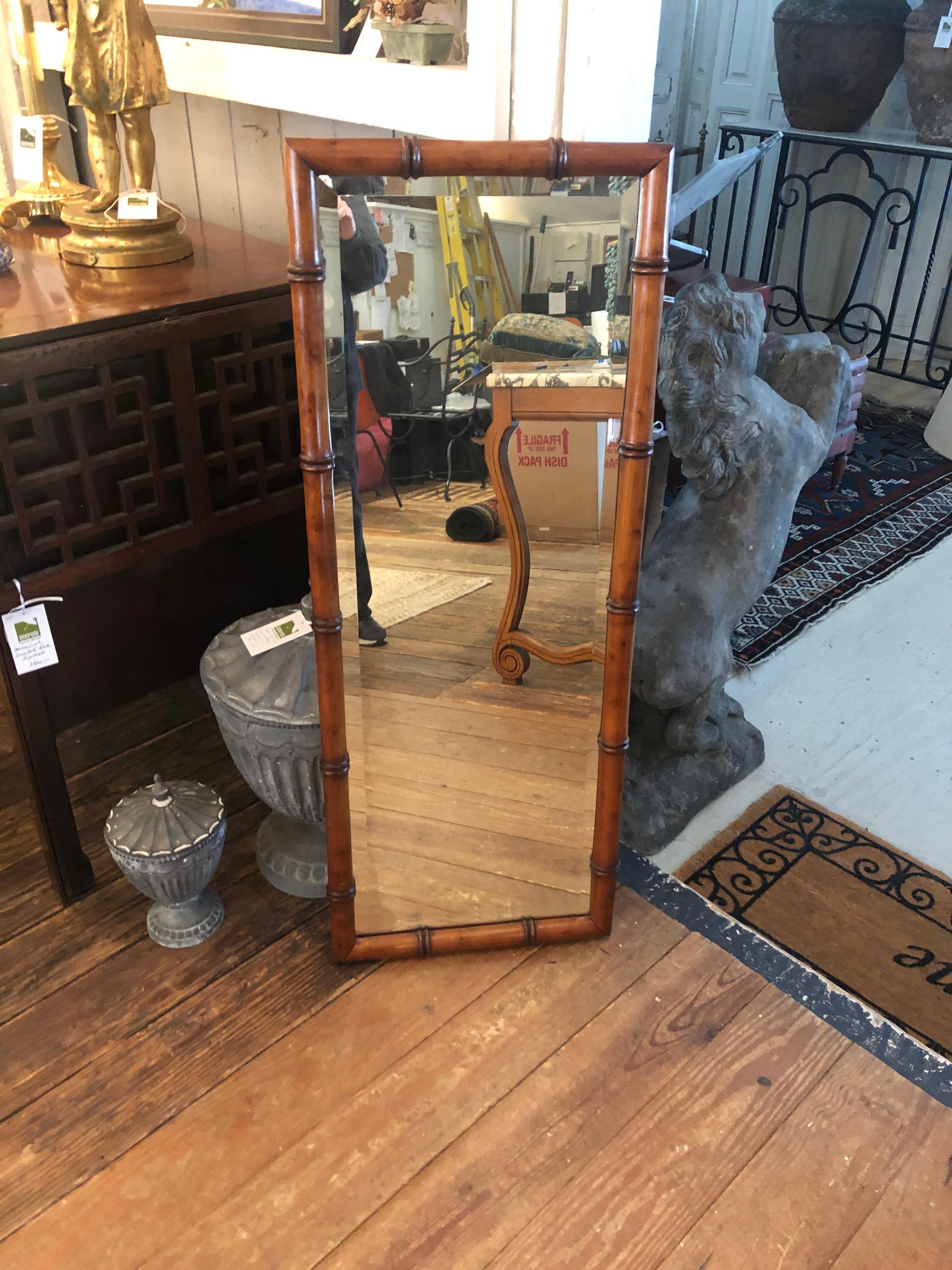 Narrow rectangular vintage faux bamboo wooden framed bevelled mirror having a handsome masculine look. Can be oriented horizontally as well.
