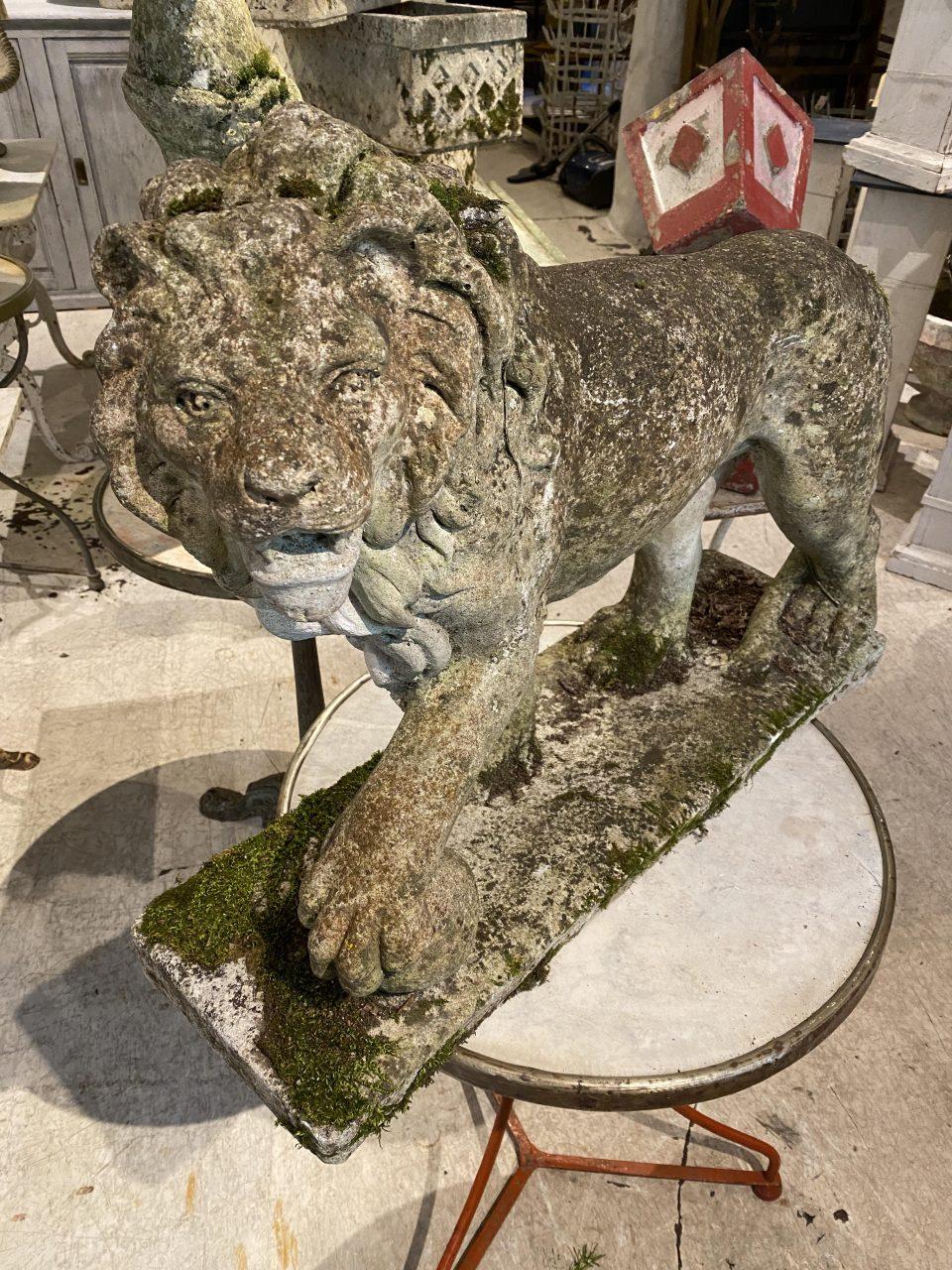Exceptionally charming garden figure / statue, from circa 1940s-50s France. Cast in cement and shaped as a regal lion. The lion statue is classically designed, with a full mane and a paw resting on a globe – a symbol of power.

Originates from an
