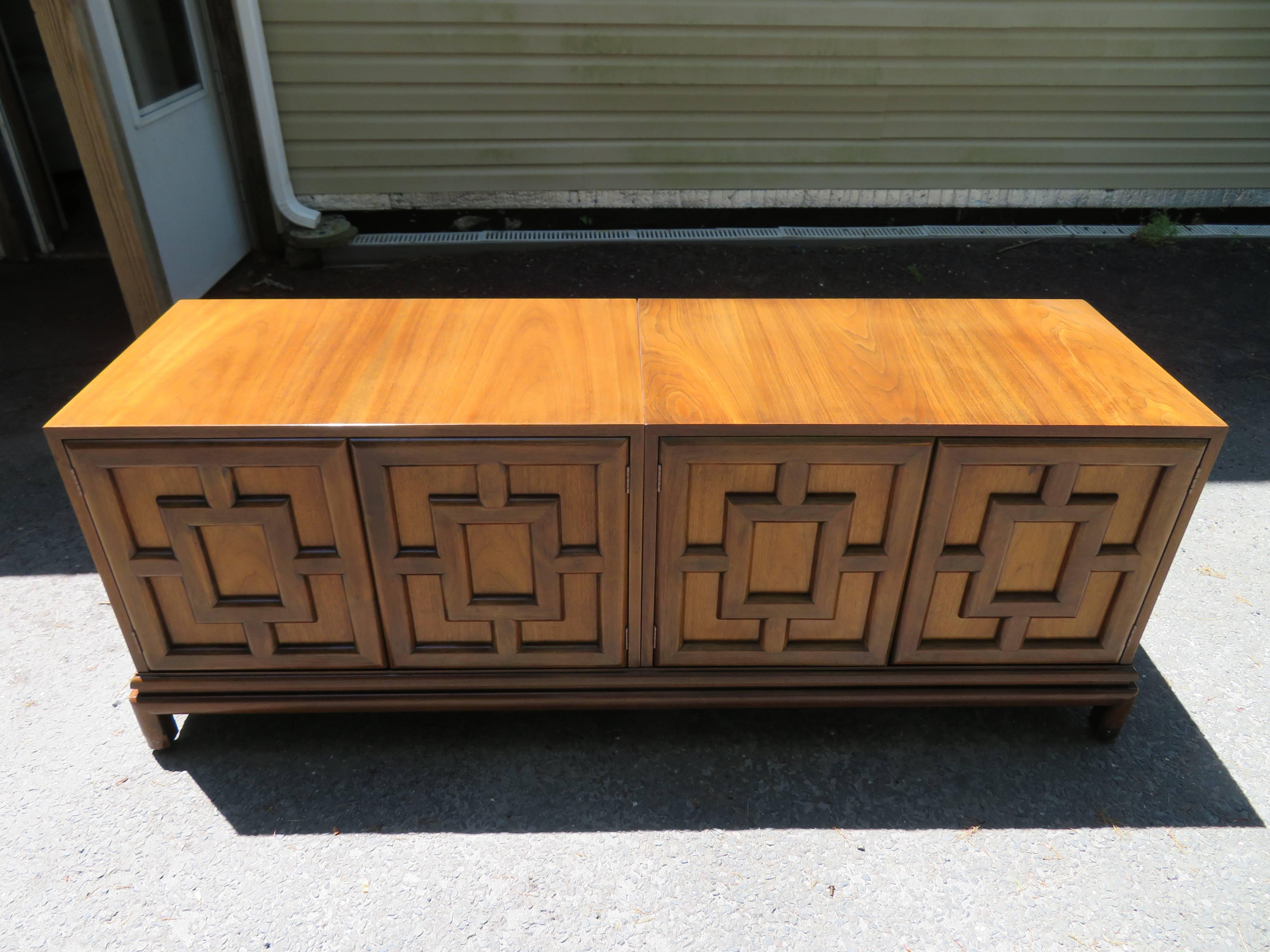 Handsome Renzo Rutuli Asian modern lattice front walnut credenza. This two-piece credenza is perfect for your TV room with two open cabinets-one adjustable shelf each, all sitting on removable base. One cabinet has it's back removed for easy use of