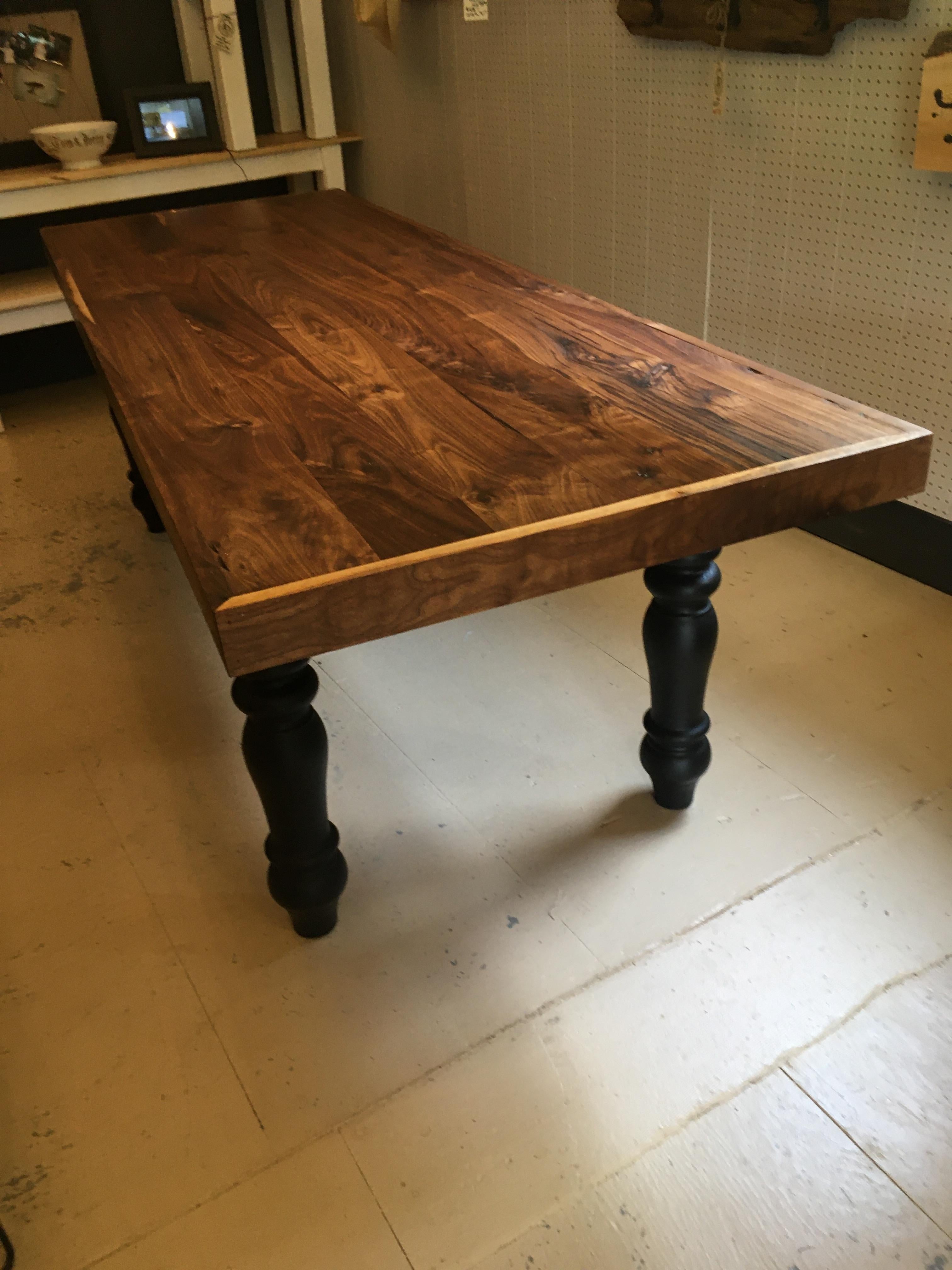 Artisan hand made heavy large slab walnut dining table having gorgeous grain and handsome chunky ebonized turned legs.
Apron 25.5.
