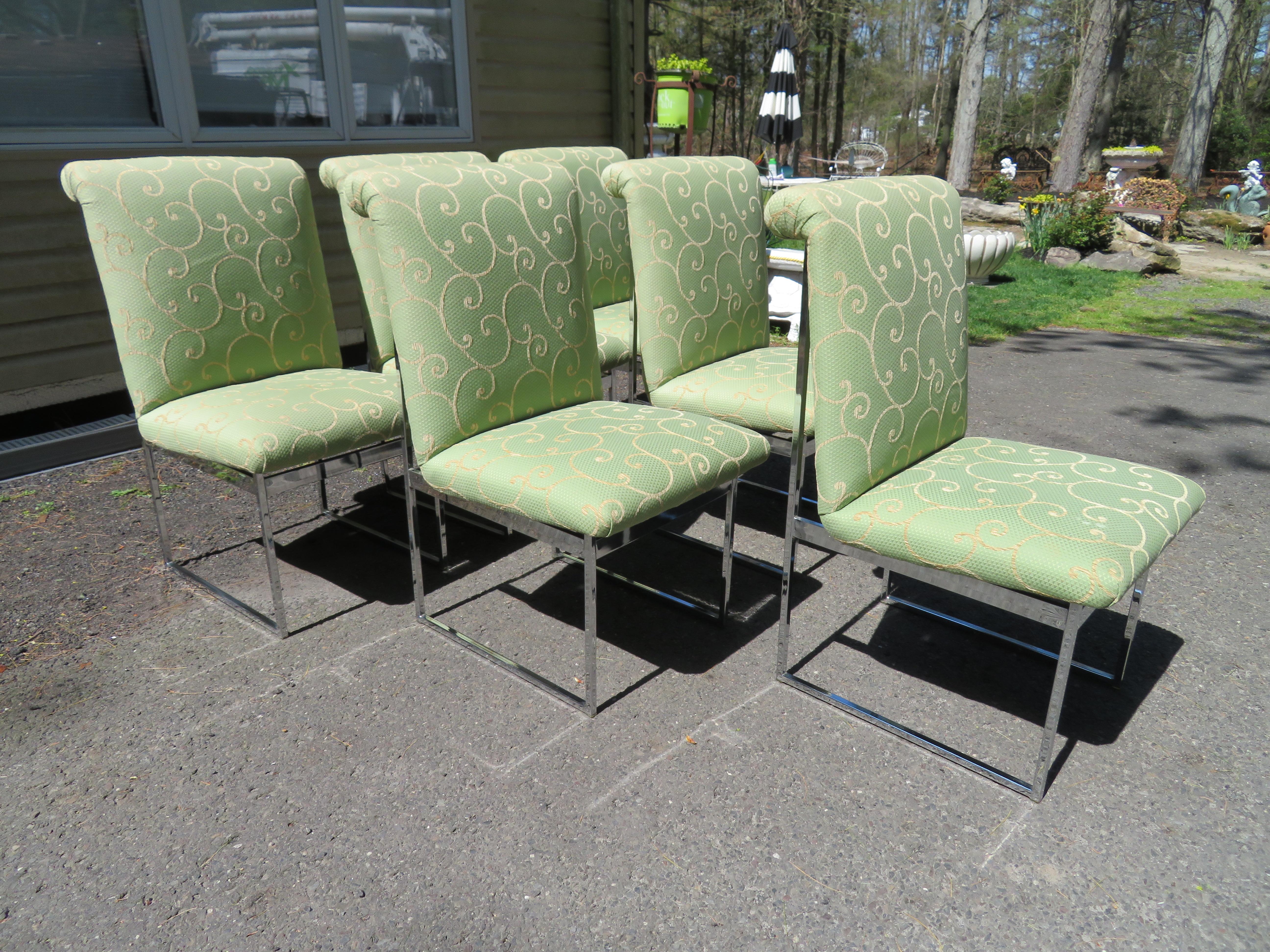 Set of 6 dining chairs with heavy polished chrome frames, designed in the style of Milo Baughman and produced by Flair, USA, circa 1960. These were reupholstered in the past 10 years in a lovely celadon green woven fabric with subtle gold swirls. We