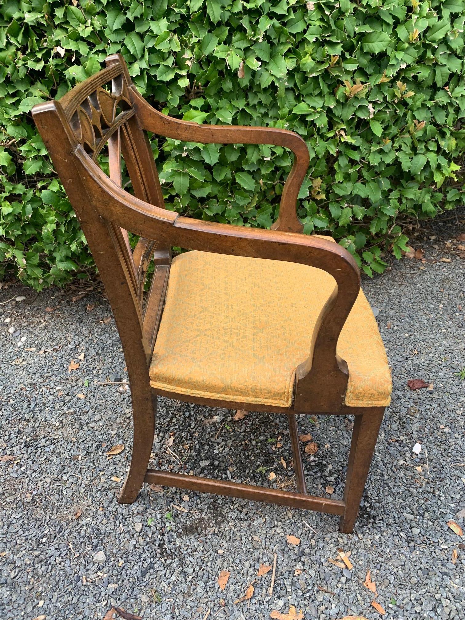 Set of 6 handsome Regency style walnut dining chairs including two with arms and 4 side chairs.

Measures: Arm height 28

Seat 21” W Seat height and depth 17.5
Arm 28” H
Chair 33” H x 21” x W 21” D.