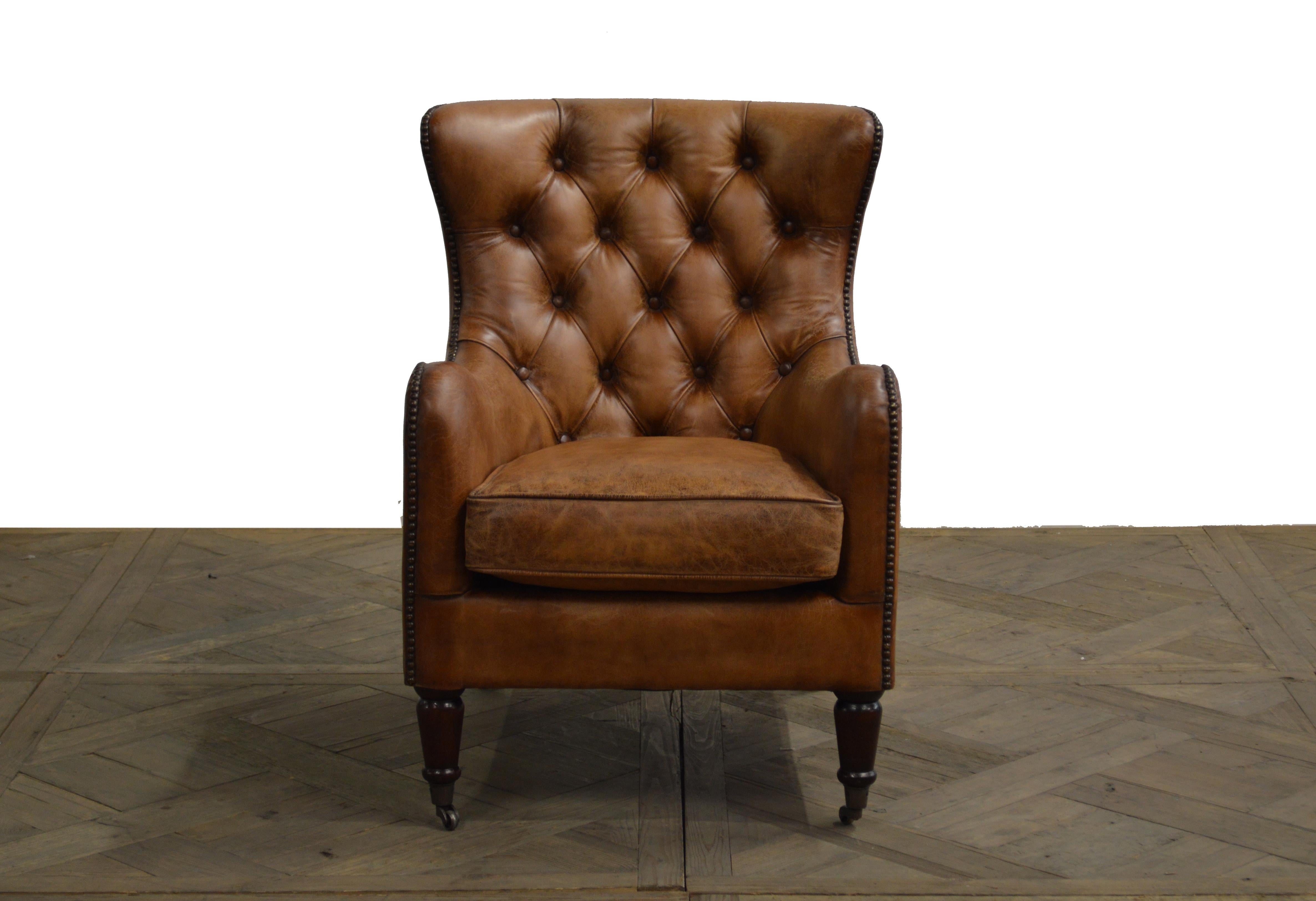 Handsome set of four Regency style leather library chairs with tufted backs. Priced per chair.