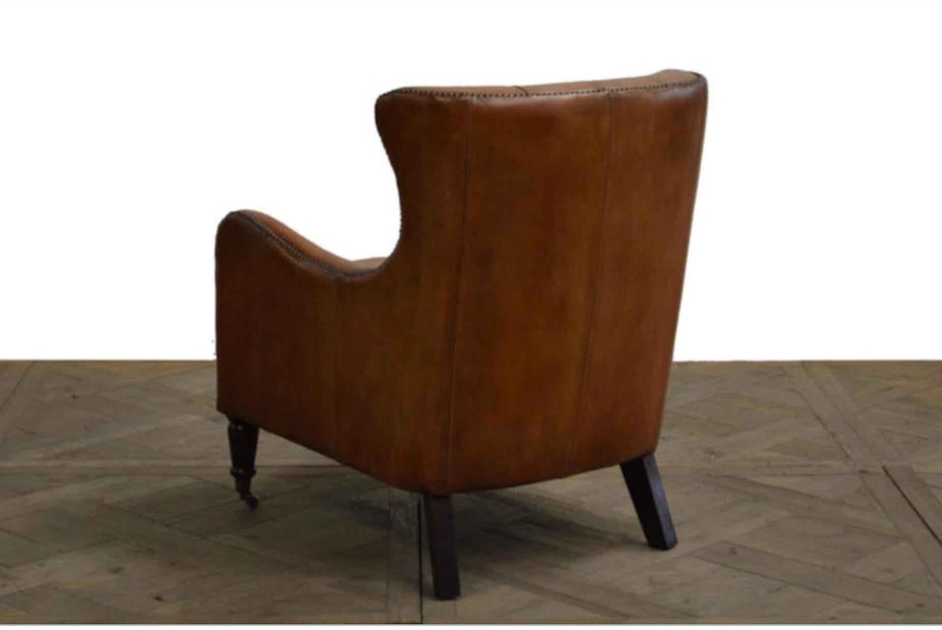 Handsome set of four Regency style leather library chairs with tufted backs. Priced per chair. Would look fantastic in a library or office.  Great in sets of four.