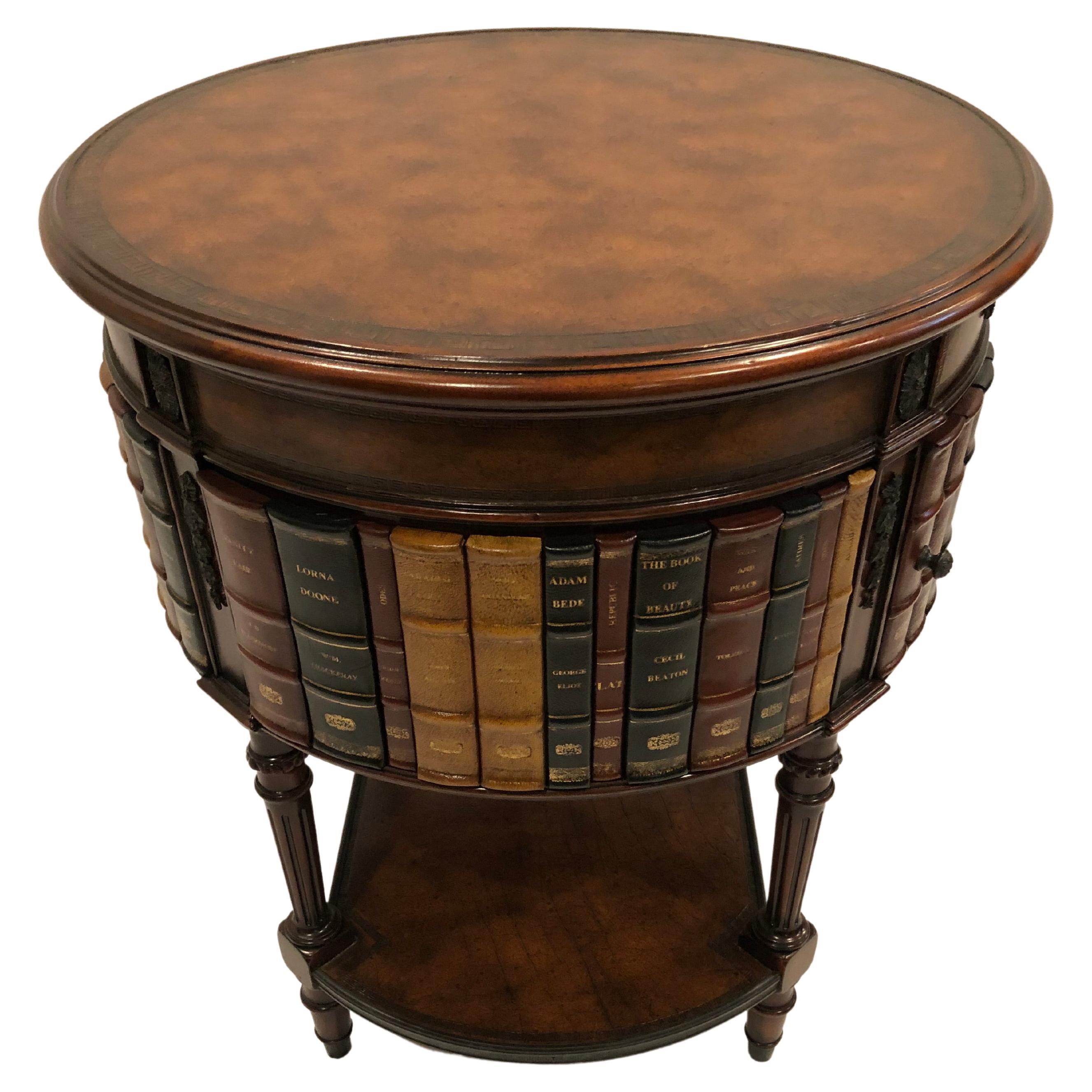 Stunning trompe l'oeil leather book motif round side table having embossed leather top and sides that look like a collection of leather classic books. There is one drawer and a door that opens to reveal storage within.