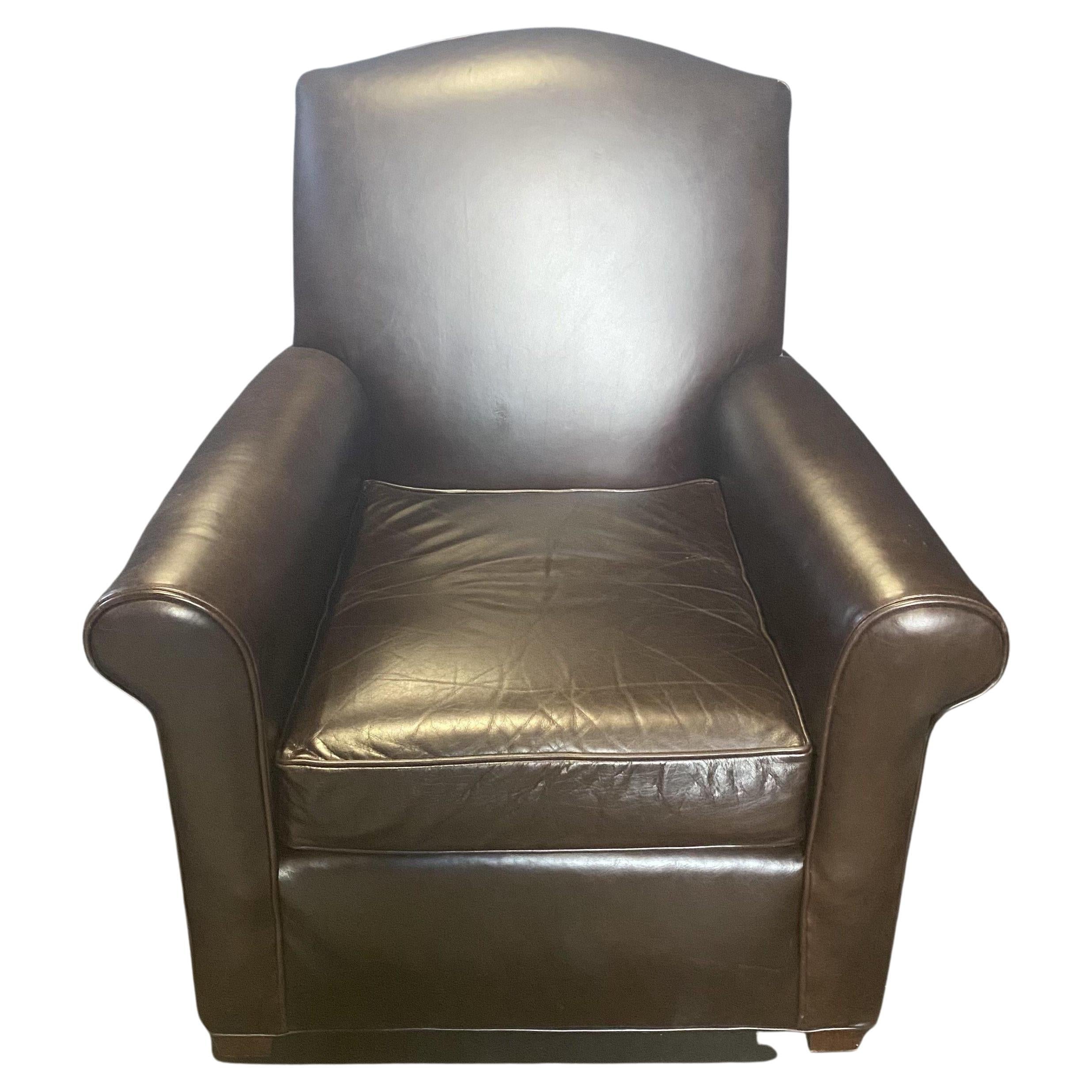 Vintage dark tobacco brown leather club chair and matching ottoman by San Francisco designer Mitchell Gold. The back, arms and seat have a lovely piping detail. #5607
 Measures: H ottoman 16” W ottoman 27.5” D ottoman 23” 
 H chair arm 24” W.

