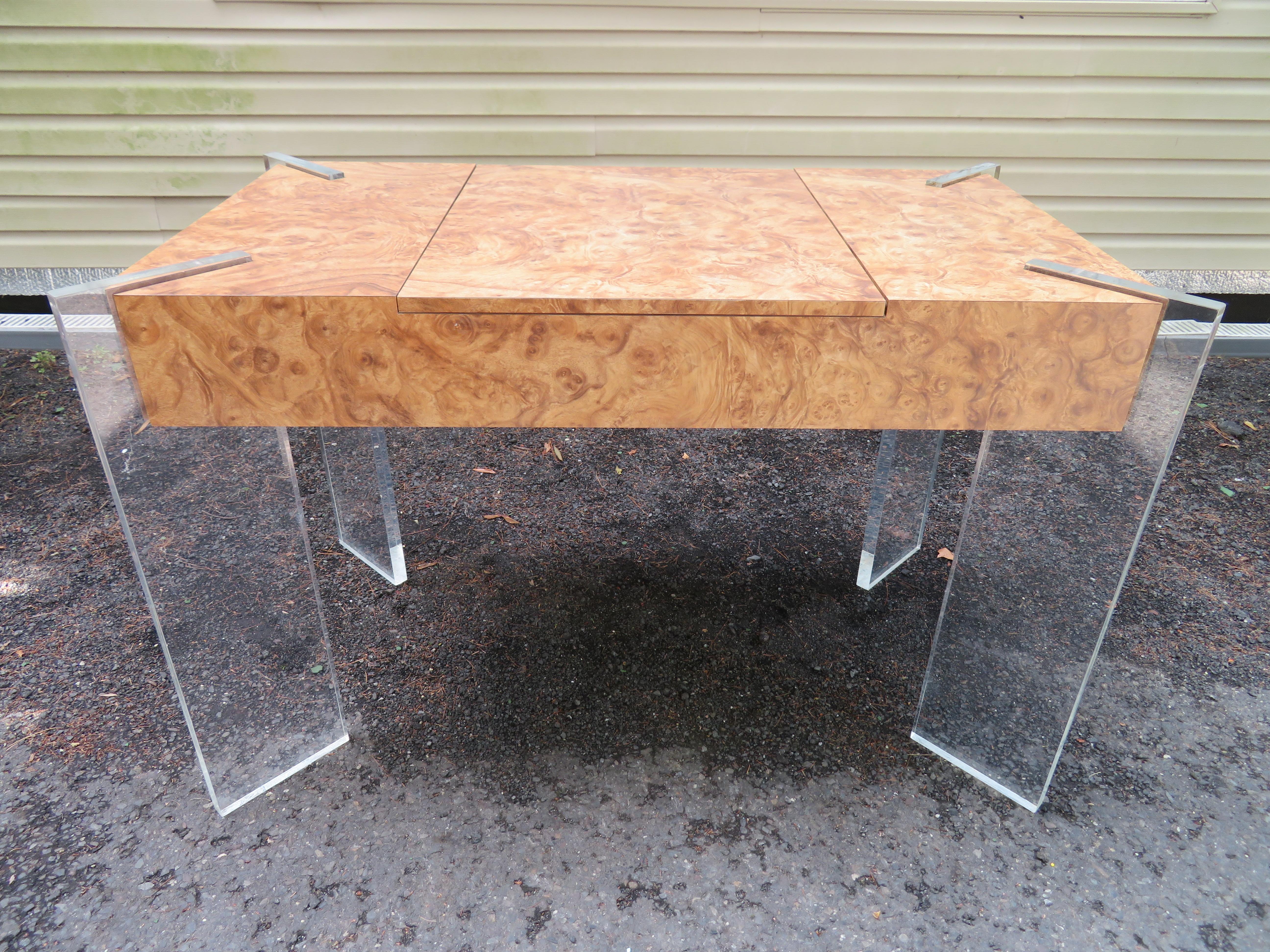 Handsomeburl laminate game table with thick Lucite slab legs. We love the burl laminate as opposed to real wood-kid and adult friendly. This piece can be used as a petite desk with removable top on and backgammon table with top off. The original