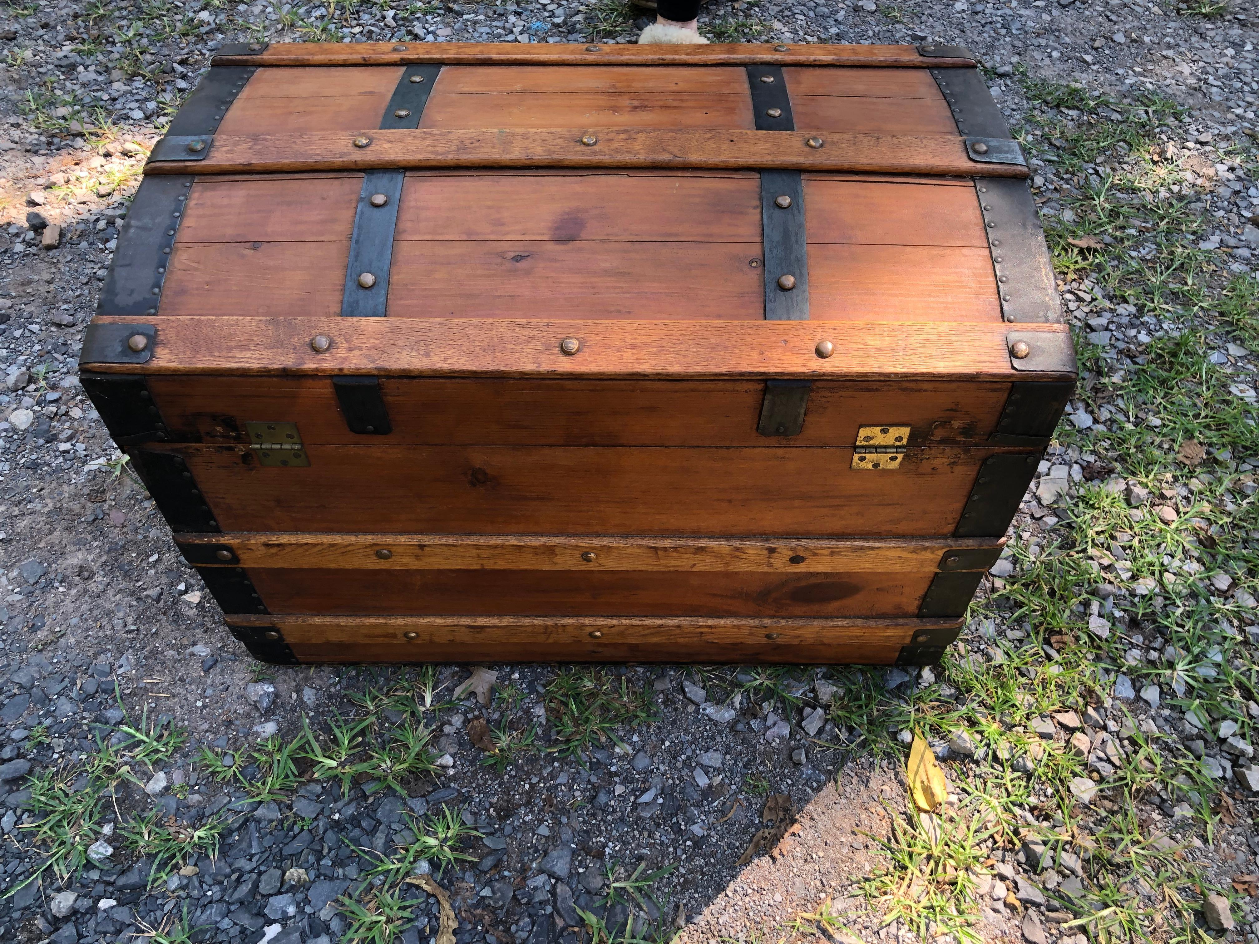 Handsome old wooden trunk or chest having great looking heavy straps of iron with nailhead detailing.