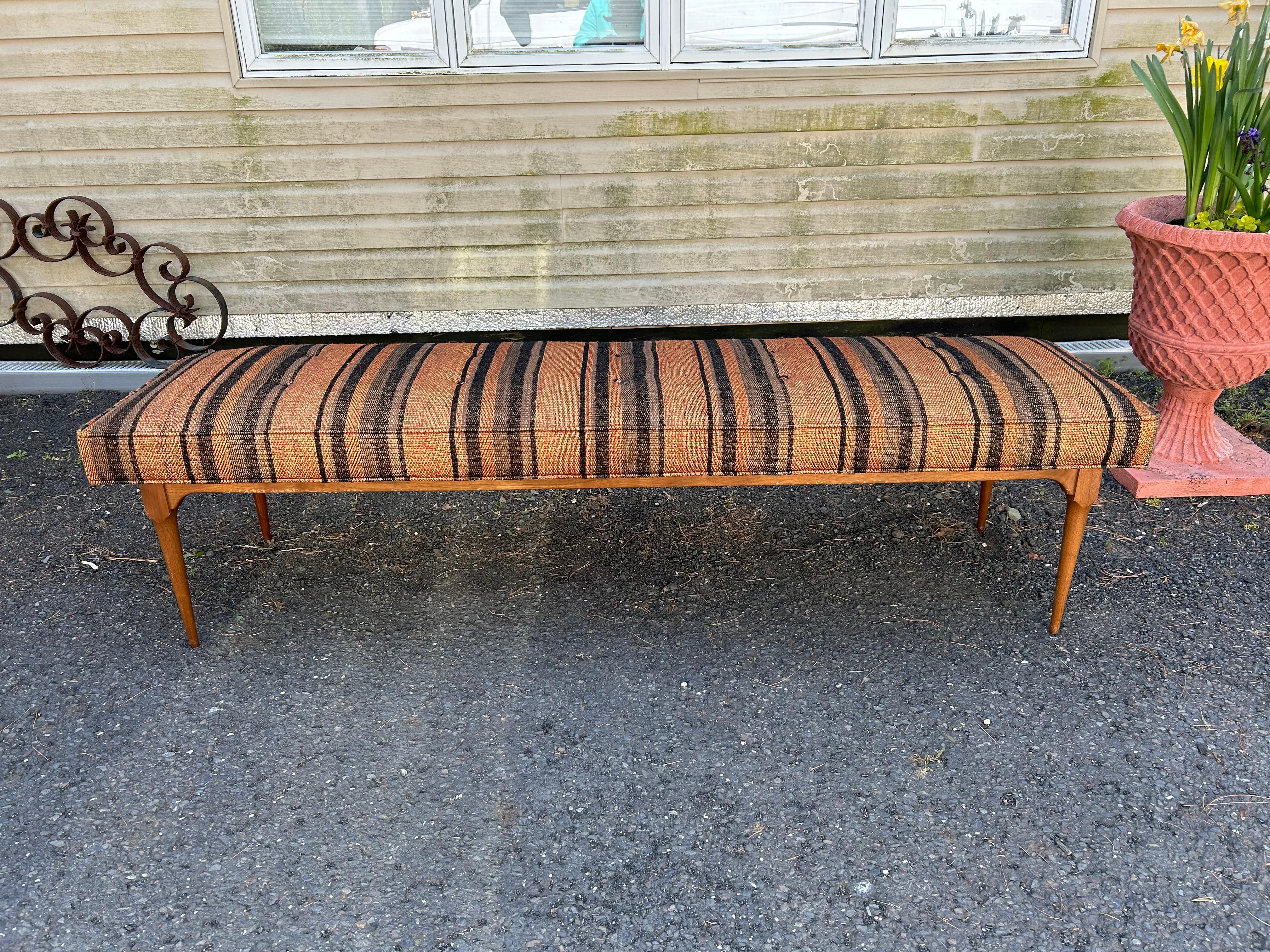 Handsome X-long Harvey Probber style walnut bench.  The original striped woven fabric still looks quite nice with only light signs of use.  This piece measures 18.5