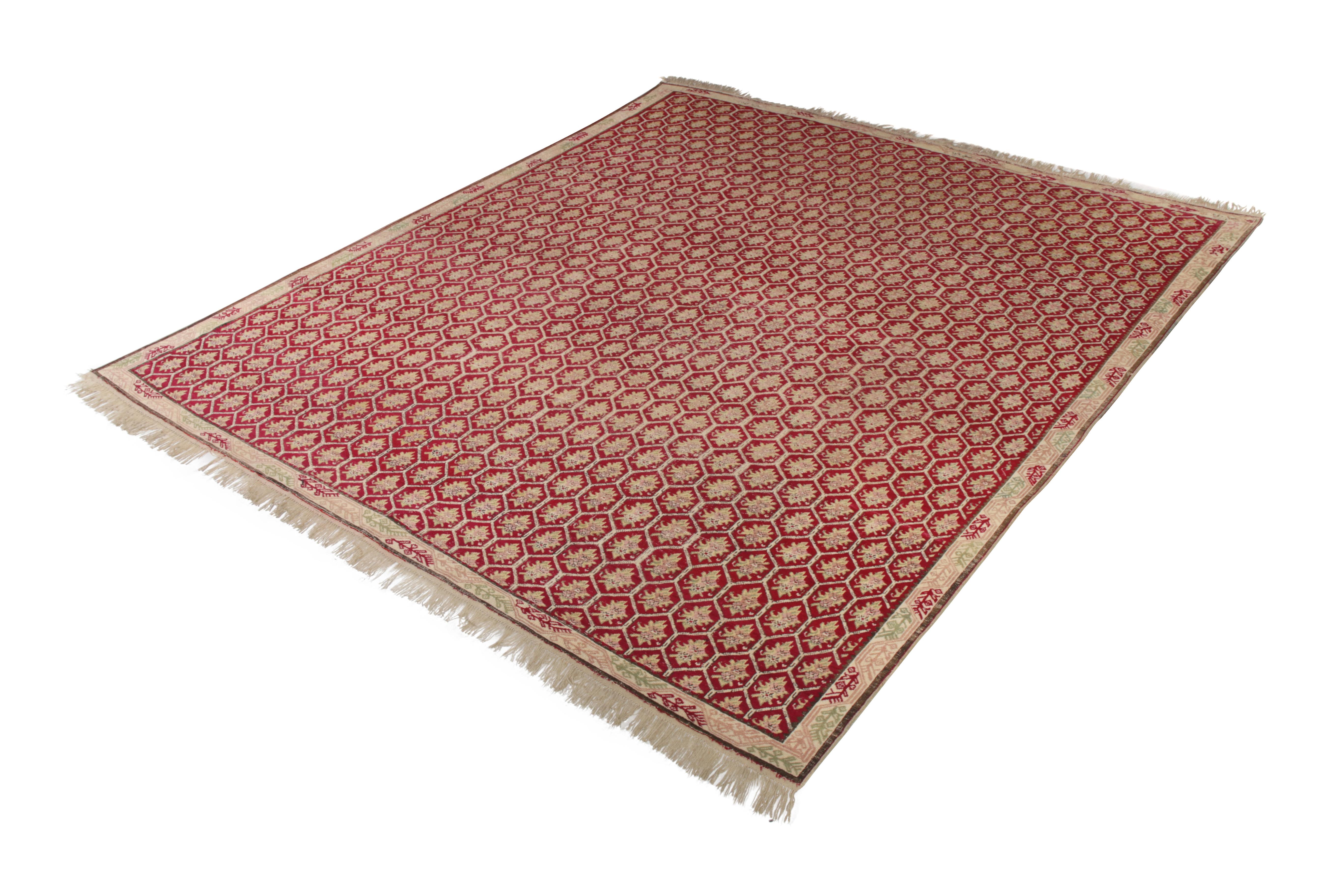 An 11 x 13 antique Kilim rug in red and beige, originating from Turkey circa 1920-1930. This handwoven wool Kilim is hails from distinctive, excellent small print antique Turkish rugs with several celebrated decorative qualities.

On the design: