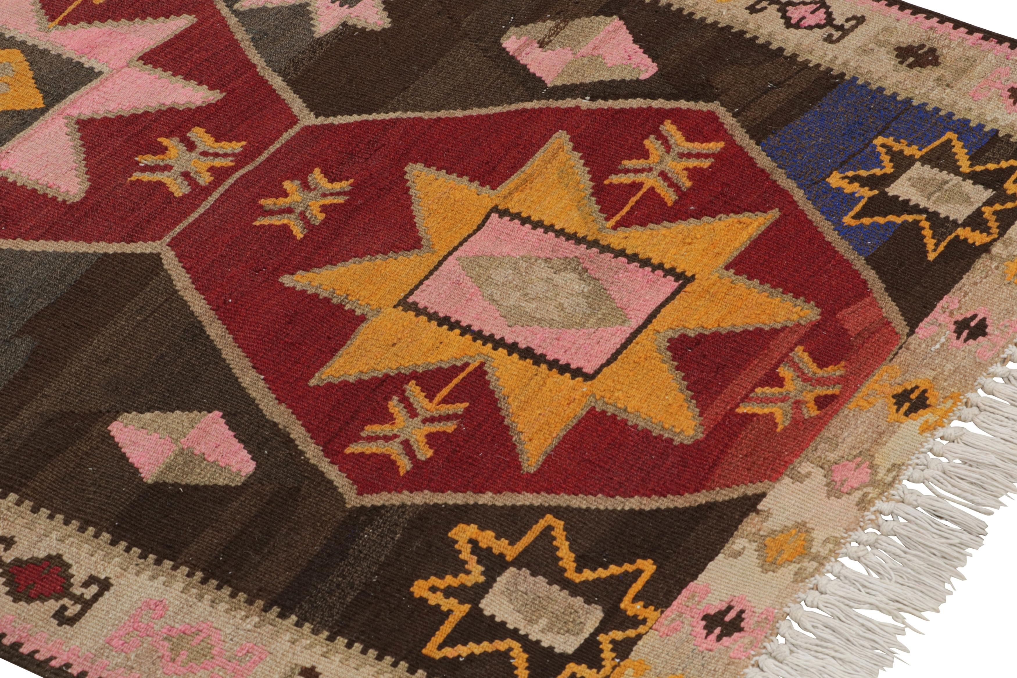 Handwoven in a wool flat-weave originating from Turkey circa 1910-1920, this antique Kilim rug enjoys an early 20th century Kurdish Kilim design, a wide runner in size with both traditional and rare colorways in this take on the time-honored