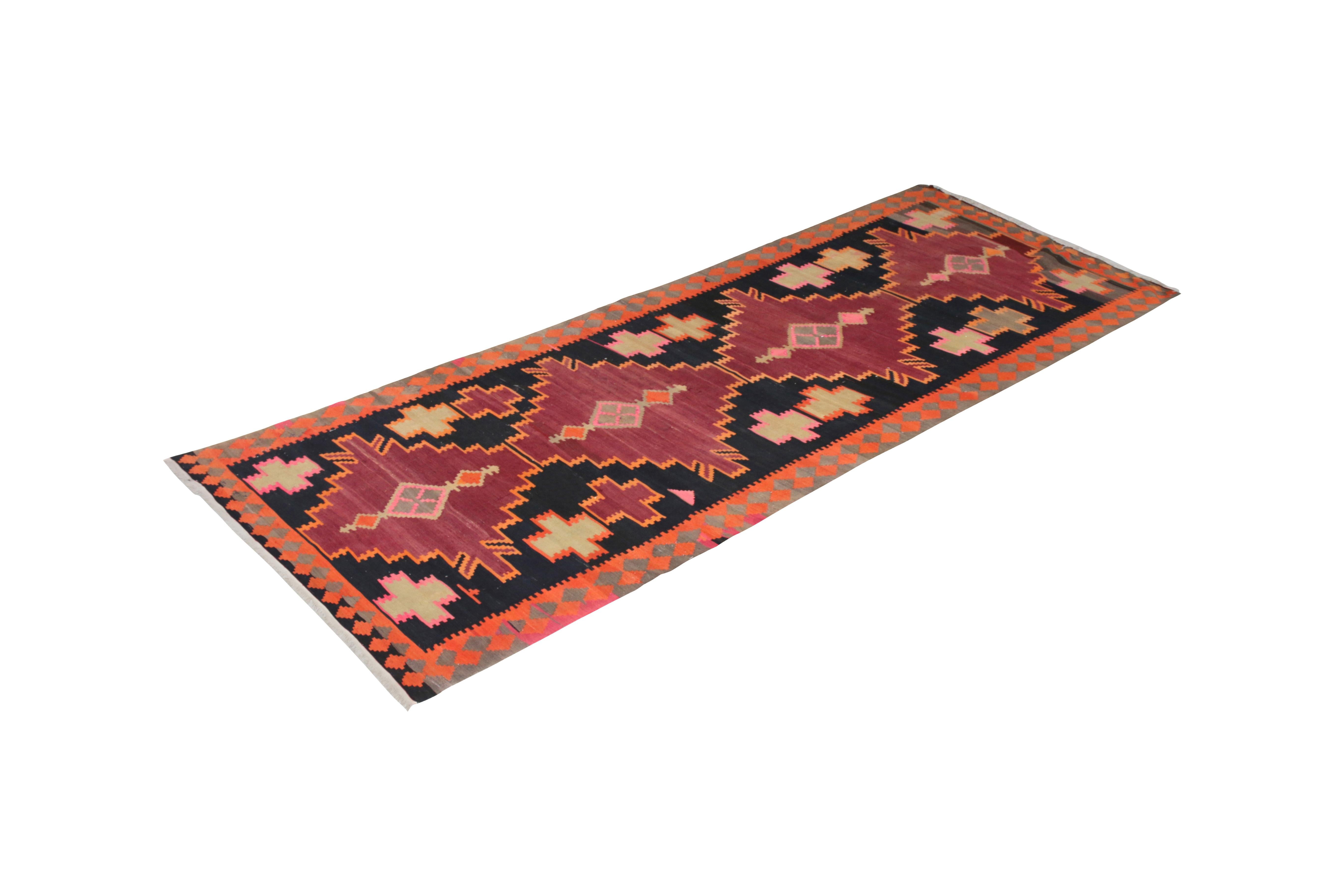 Handwoven in a wool flat-weave originating circa 1910-1920, this antique Kilim rug connotes a Northwest Persian Kilim design, one of our principal’s personal favorite selections from our collection with a rare wine burgundy colorway. Set against a