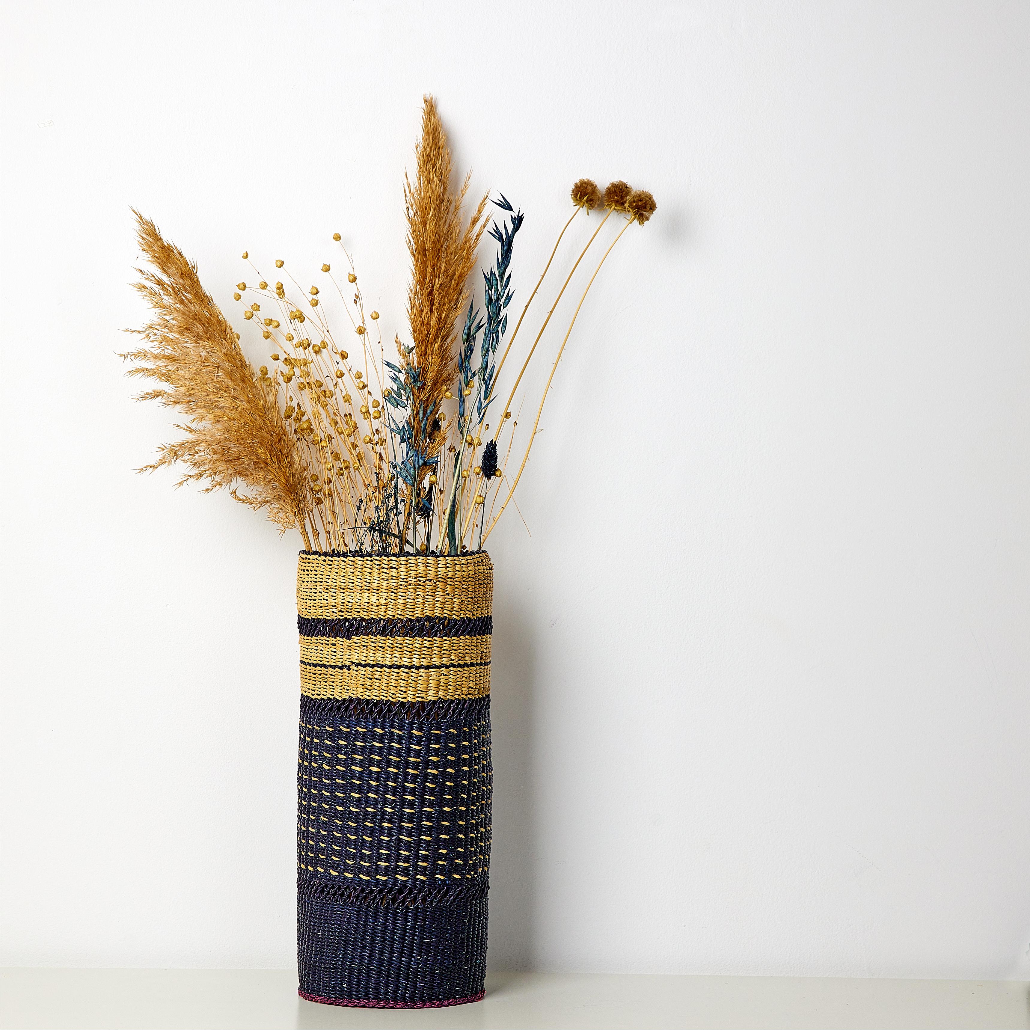 Hand woven blue black vase:

Mysterious elegance

Colour: Blue Black

Characteristics

33x18cm hand woven straw table mat;
Available in 2 colours : Burgundy Red, Blue Black

Are you looking for a unique vase for dry flowers?
This natural vase is