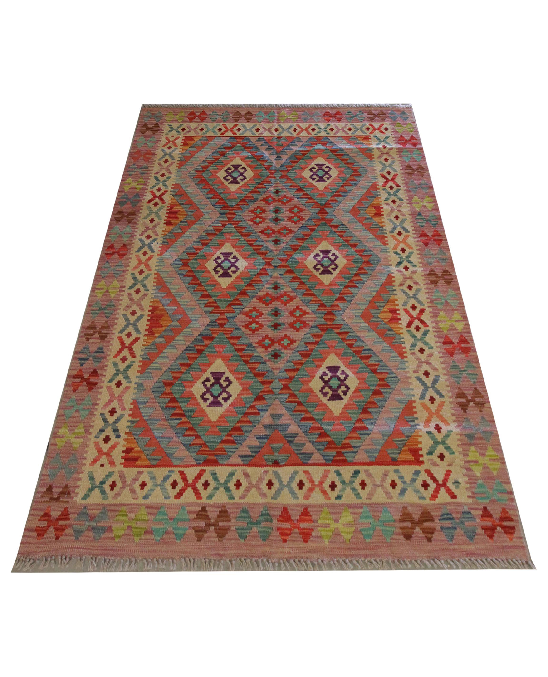 This alluring geometric kilim is a handwoven Afghan flatwoven carpet constructed in the early 21st century. The design is striking with diamond hook medallions woven symmetrically in a grid format in a rich colour palette, including blue, purple and