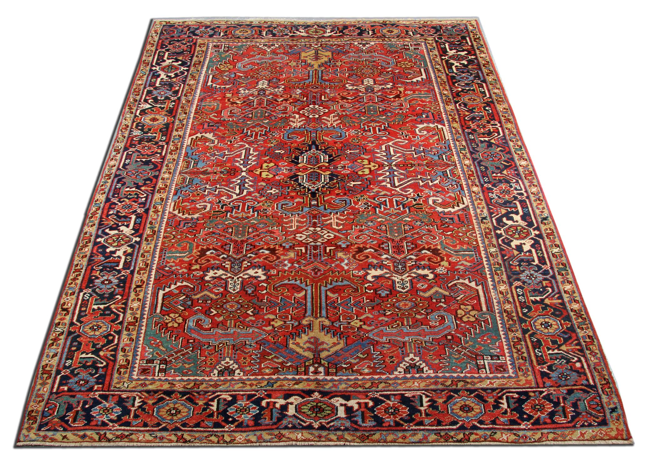 Looking to upgrade your floors with anantique rug? This piece is sure to wow your guests…
This fine wool rug was woven by hand in the 1910s and features a bold all over central design with a decorative enclosing border. Woven on a rich red