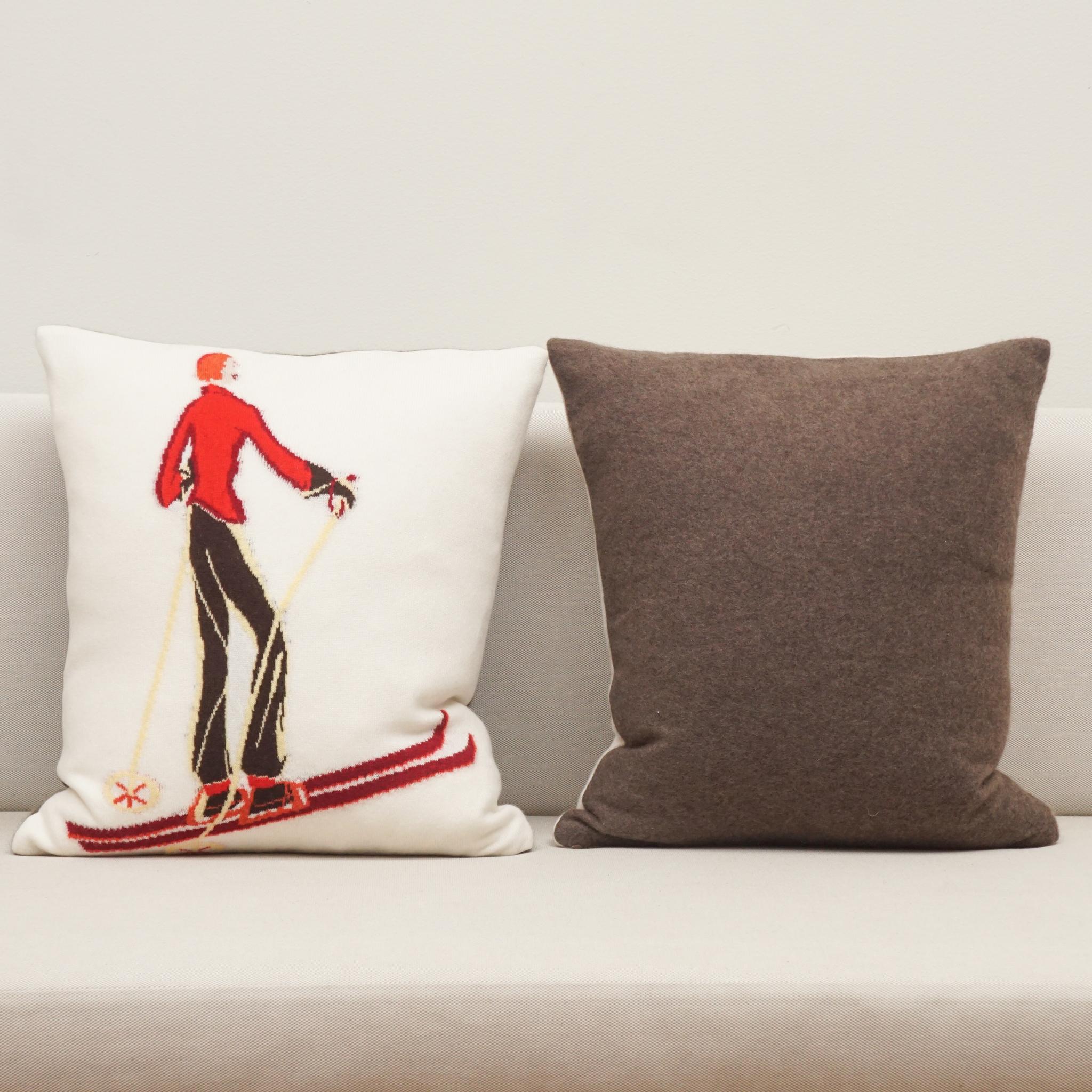   The decorative pillows, shown here, are certain to become one of your seasonal favorites for years to come.  Made in Austria, each ivory cashmere pillow is woven with an animated and brightly colored skier making them both decorative and