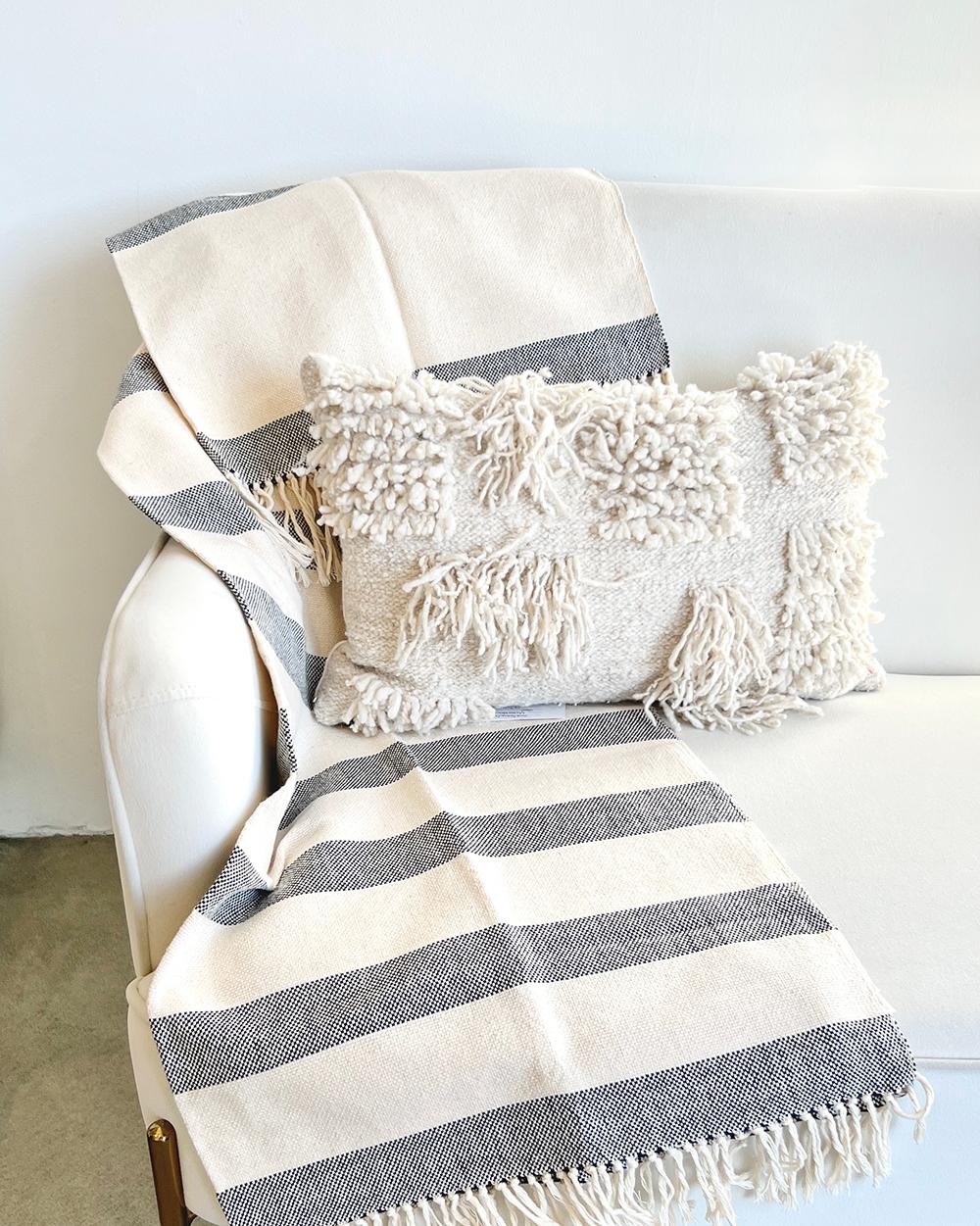 The perfect throw for your bedroom
This highly stylish and modern gradient stripe Amano throw is the perfect addition to any home. Crafted with a clean, crisp white and navy striped pattern, the fringe details offer a contemporary look. Handmade