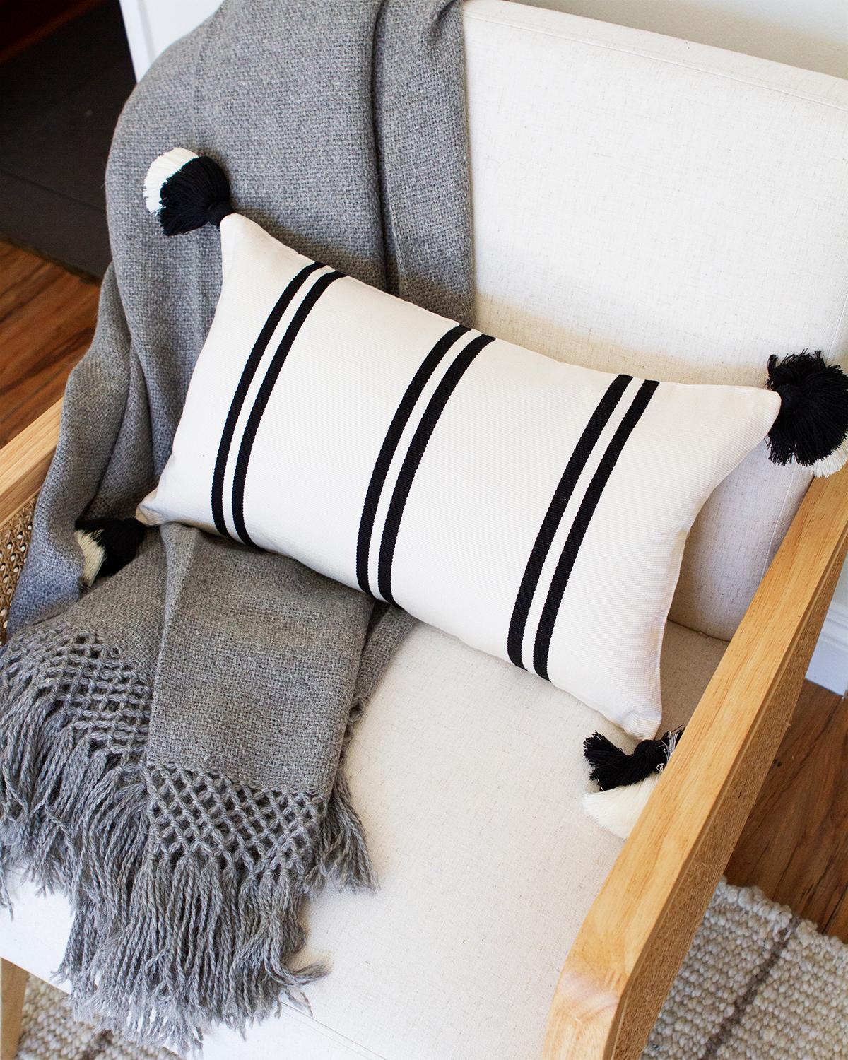 Artisanal Home Pillows made from 100% Pima Cotton

This black and white lumbar home decor pillow was hand woven on back strap looms in Peru out of 100% Pima cotton. Finding the right throw pillow for the couch in your living room or the bed in your