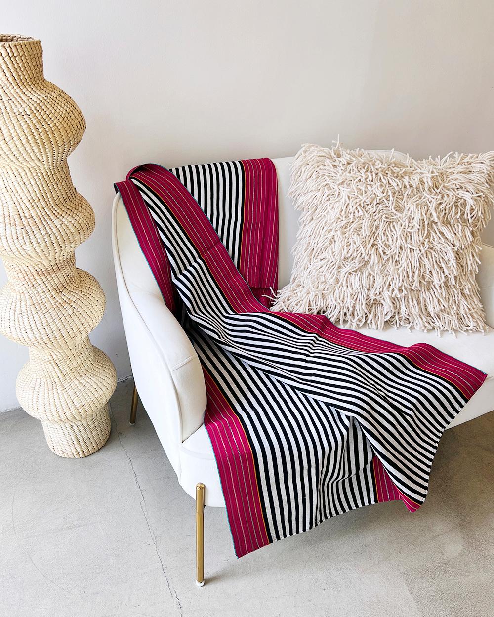 A bold and colorful throw for your home

This classic striped blanket is handmade and crafted in Mexico from organic cotton and natural dye, blending traditional and modern elements in a bold and graphic design. Perfect for elevating any home decor,