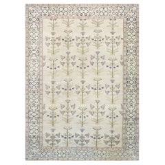Disegno floreale d'ispirazione agra intrecciato a mano su lana naturale al 100%.