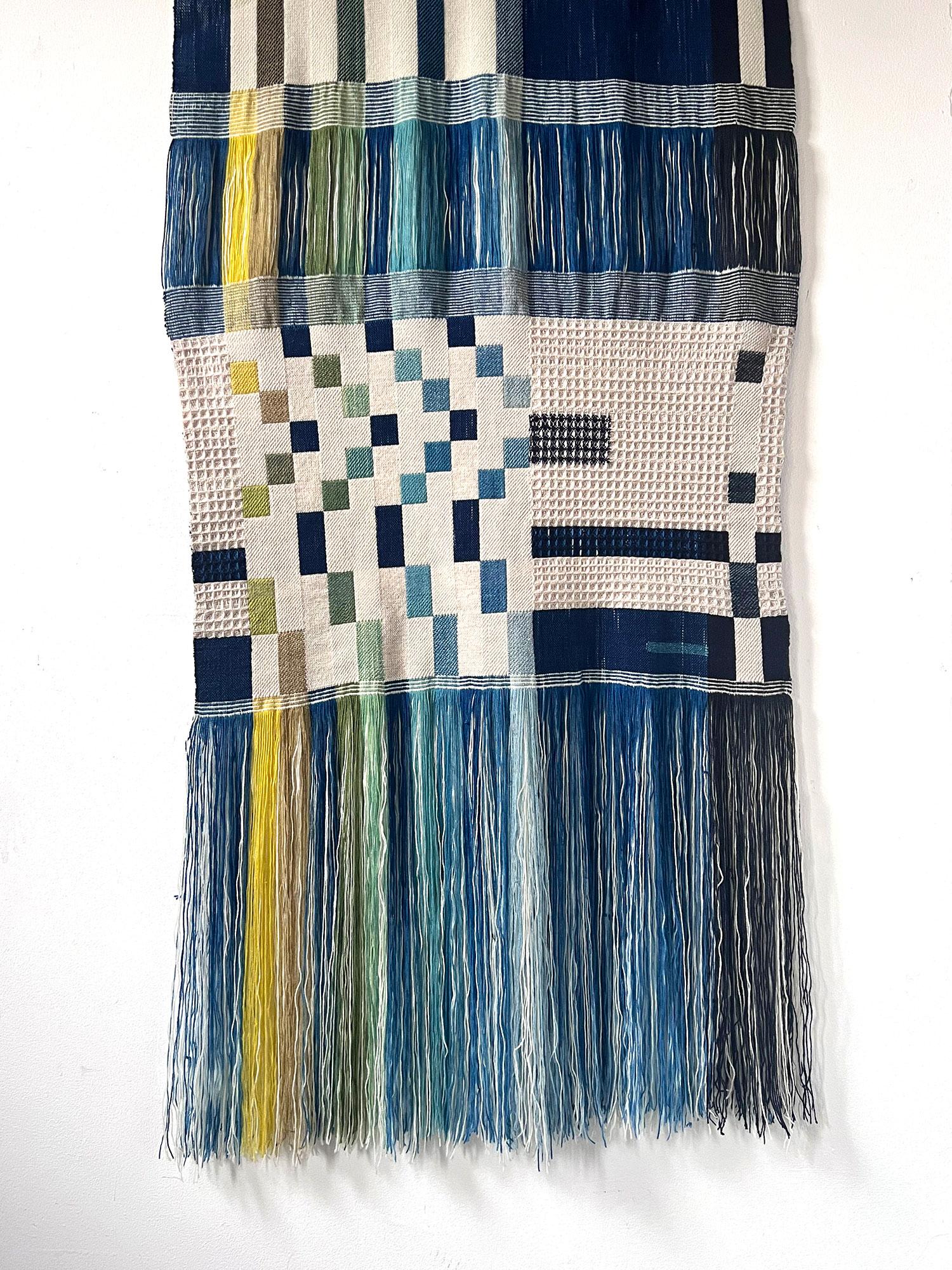 This striking contemporary piece of Handwoven textile art is one of a collection of one-off plant-dyed pieces designed and produced by British Weaver Pamela Print.

This piece is dyed by hand using natural and repurposed yarns and techniques such as