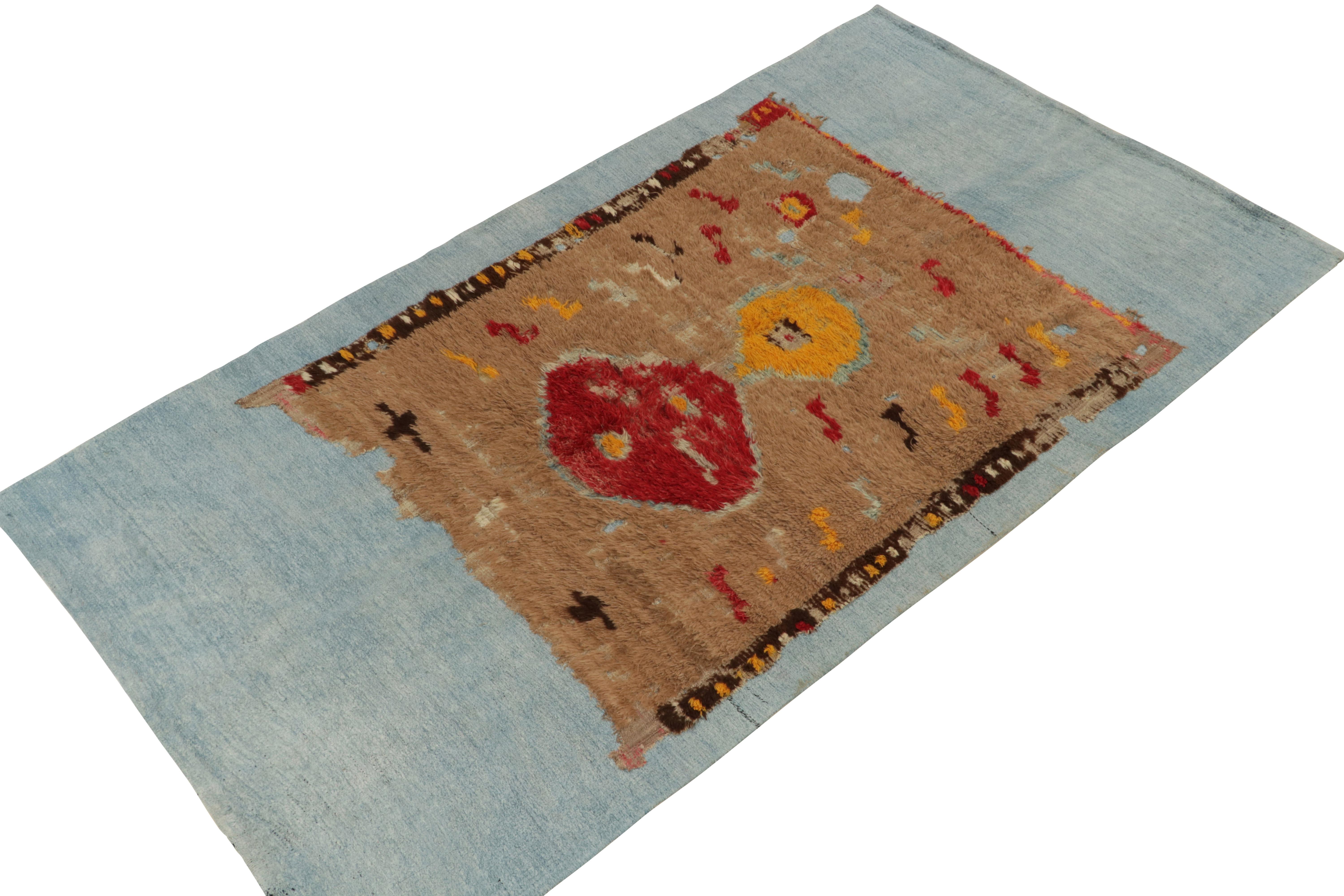 Turkish Rug & Kilim's Distressed Brown rug fragment on blue flat weave For Sale